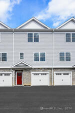 Each townhouse has a private single car garage.