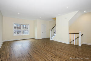 Another view of the living room with half bath at the far end.