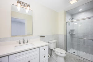 This large bathroom boasts a generous shower.