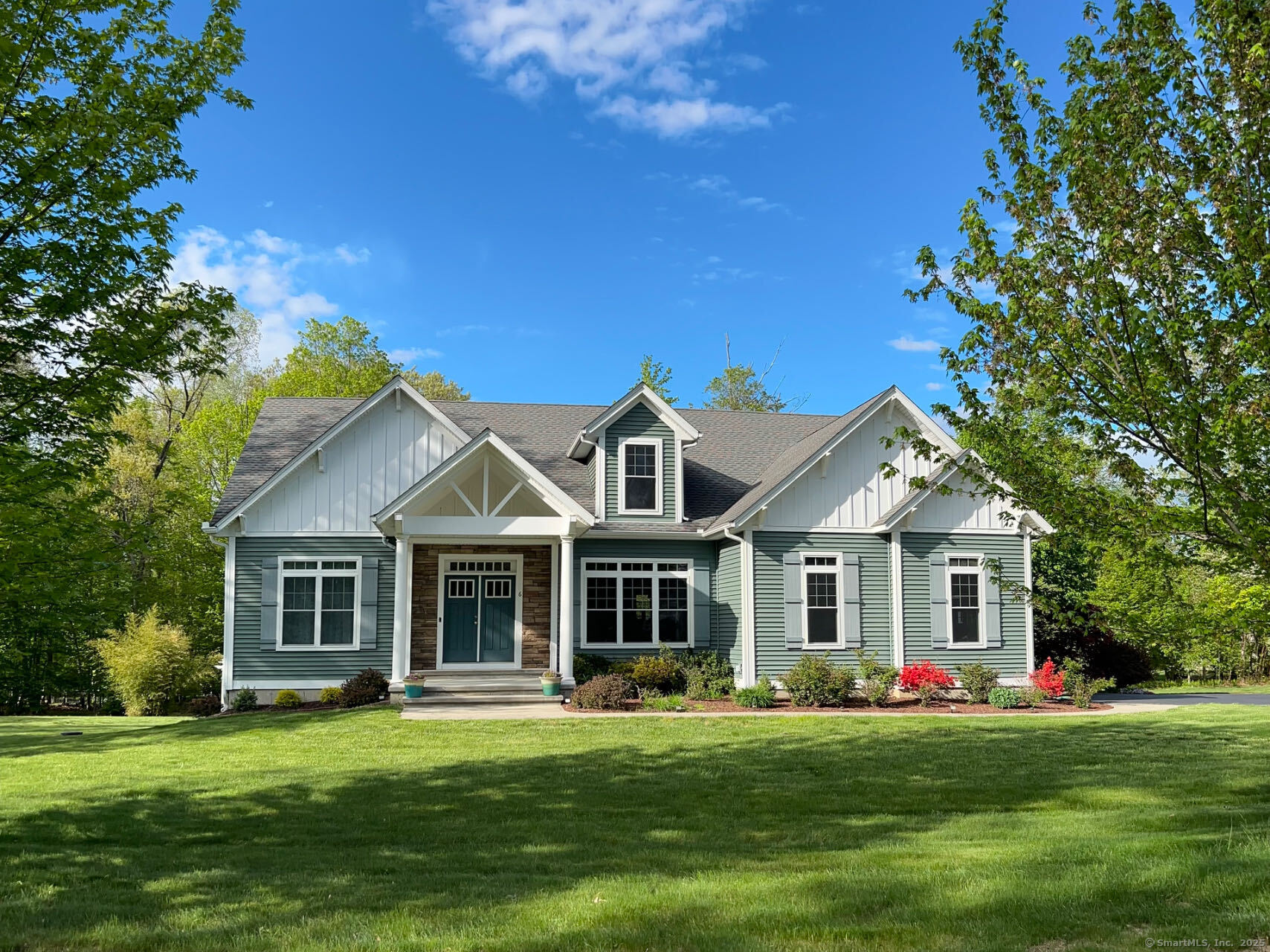 A beautiful and customized sunny Cape in a desirable neighborhood close to UConn and all shopping. First time on market, This house features an open & sunny floor plan with over 3460 square feet of living space, including 4 bedrooms, 1 study hall, and 3 full bathrooms and one sauna room. The open & sunny floor plan boasts lots of natural light. On the main level, you will find a spacious, bright, and open family room, with three window that slides into a deck that oversees a big private yard, a formal dining room with a large window, a large eat-in kitchen with granite counters, central island and lots of cabinets, a breakfast area, and plenty recessed lights. The main level has 2 bedrooms and 2 full bathrooms. The master suite has his & her WICs, a full bath, a shower, and a tub. Another full bathroom with sauna room also on the main level. There is a two-car garage with EV car charging system and a front porch. The upper level has two bedrooms, both having WICs, a study hall with all-day natural light, and a full bath. The lower level is a full walkout basement, with four windows, a walk-out French door, approximately another 1000 sqft that is ready to be finished. The whole house is wired for backup generator. Hiking trails nearby. Minutes to elementary, middle, and high schools and UConn. It is a pleasant must-see piece.