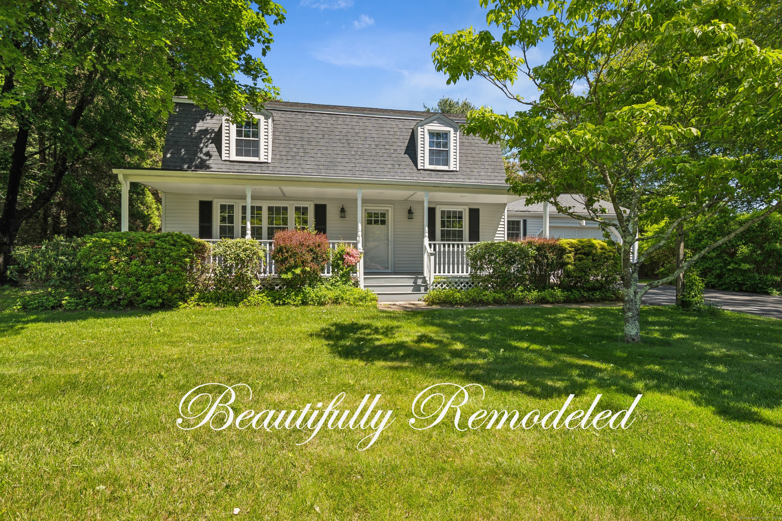 This beautifully updated 3-bedroom home is nestled on nearly 3/4 acre on a quaint neighborhood cul-de-sac in the heart of East Lyme, a picturesque place for evening strolls & peaceful mornings on the front porch. Inside, the large living room featuring a sunny picture window, leads to the family room complete with a whitewashed fireplace & a bay window, offering a cozy spot to unwind. The new remodeled kitchen is the ideal place to gather, with a spacious island, crisp white cabinets, gleaming granite counters, stainless-steel appliances & even an inviting breakfast nook. The adjacent slider opens to the freshly painted back deck overlooking the expansive, lush, green lawn & above-ground pool, perfect for entertaining. 2 full bathrooms-1 with a spa-like shower, the other with a new tub-have been tastefully redone, including new stylish vanities. New luxury vinyl flooring, beautifully refinished hardwood floors & new lighting boast modern charm throughout. This home truly has it all & offers peace of mind with a generator & many updates: fresh paint throughout, a new front door, recent electrical updates & generator hookup, septic recently pumped, 2015 roof, 2008 Buderus boiler & oil tank, March 2025 termite treatment (NO live insects or damage were found) & 2020 the garage floor was replaced & garage rear foundation wall professionally repaired per a structural engineer's recommendations. This is more than just a house-it's a home to live, grow & make memories for a lifetime.
