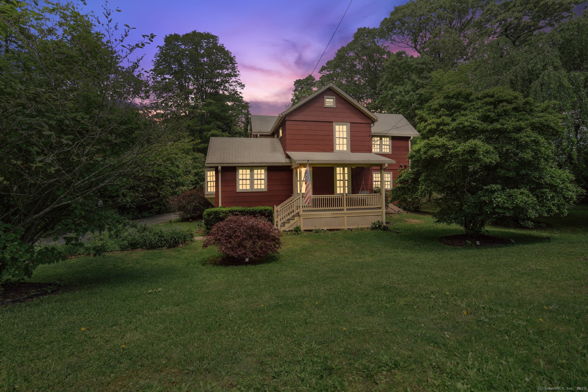 Experience the timeless charm of this exquisite farmhouse colonial set on a picturesque property with modern conveniences. Ideally located near Branford Center, this four-bedroom, two-and-a-half-bath home encompasses everything you desire. As you arrive, you'll be greeted by a lovely front porch. Spacious formal living room, leading into a well-equipped kitchen that has been tastefully remodeled. Featuring Kraftmaid cabinets, granite countertops, a farmhouse sink, a center island with a downdraft stove, stainless steel appliances & a wine chiller, this kitchen is a culinary enthusiast's dream. An exposed brick wall, large pantry & bow window. From the kitchen, you'll find a generous formal dining room, enhanced by a large bow window. The spacious living room has a gas fireplace. Unwind in the cozy library, complete with built-in bookcases and a walk-in closet featuring new flooring. The first floor also includes a remodeled half bath. On the second floor, you'll find four bedrooms, including a primary suite that boasts an ensuite bathroom with tumbled marble flooring and radiant heat-truly a beautifully remodeled retreat. There's also another remodeled full bath on this level. The home features hardwood floors throughout and, just off the kitchen, a mudroom with washer and dryer hookups that opens to a private backyard with a paved patio and retaining wall. The oversized two-car garage. Surrounded by mature landscaping, this property has undergone numerous updates, including