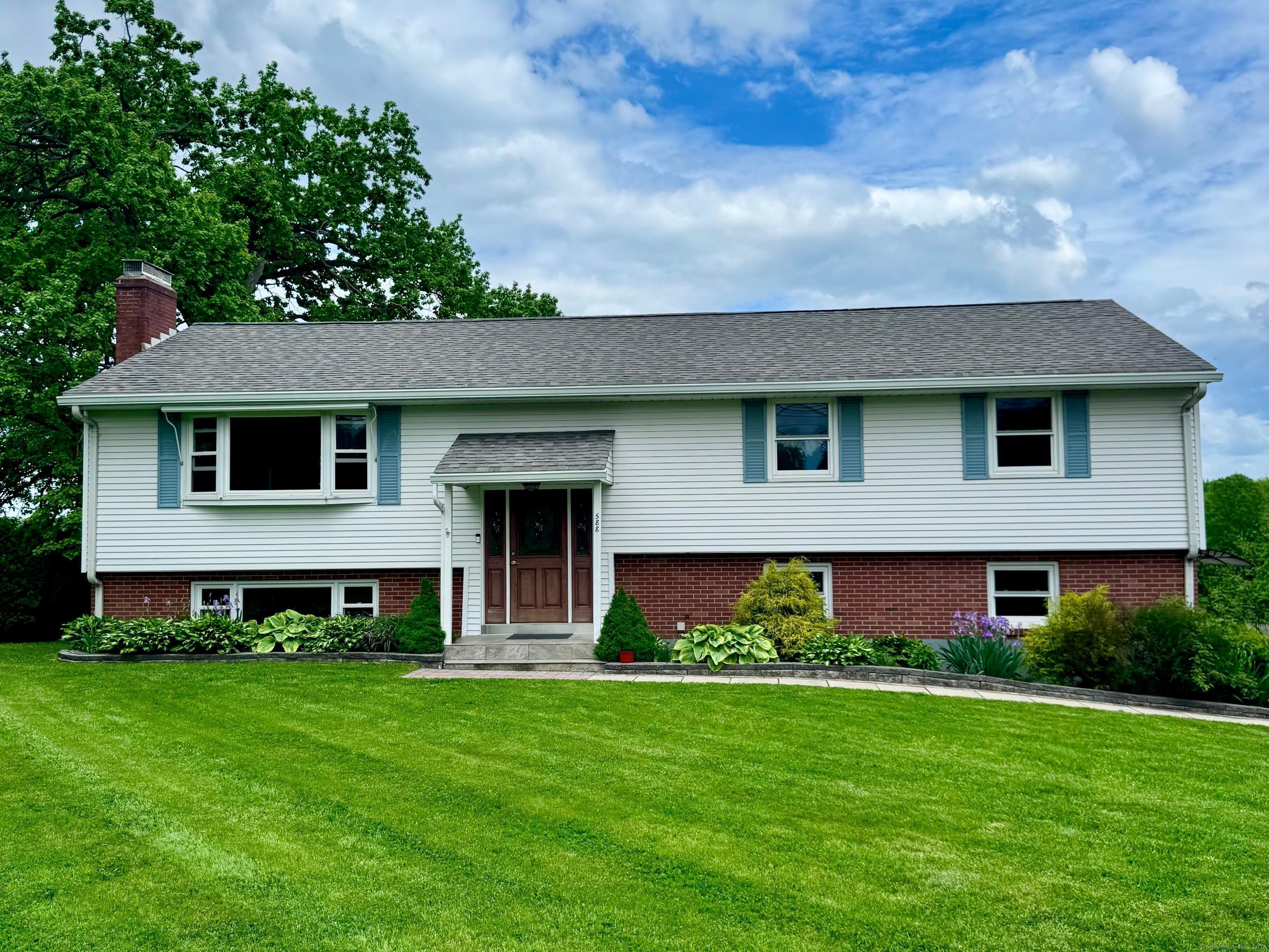 Welcome to this beautifully maintained raised ranch offering 4 bedrooms and 2.5 bathrooms, nestled in the sought-after Poquonock area of Windsor boasting .76 acres of land. Step into a bright, open-concept living space that seamlessly blends comfort and style. The main level features a welcoming living room, a formal dining room, and a cozy family room with a skylight that floods the space with natural light. Enjoy easy access to the upper-level deck-perfect for outdoor entertaining or relaxing evenings.  The heart of the home continues downstairs with a recently renovated fully finished basement that provides a spacious second living area.  The primary bedroom suite is a true retreat with its own full bathroom, a generous walk-in closet, and private doors leading to the lower-level deck.  Don't miss this opportunity to own a spacious, versatile home in a quiet, well-established neighborhood-perfect for modern living and entertaining alike.  Schedule your showing today!
