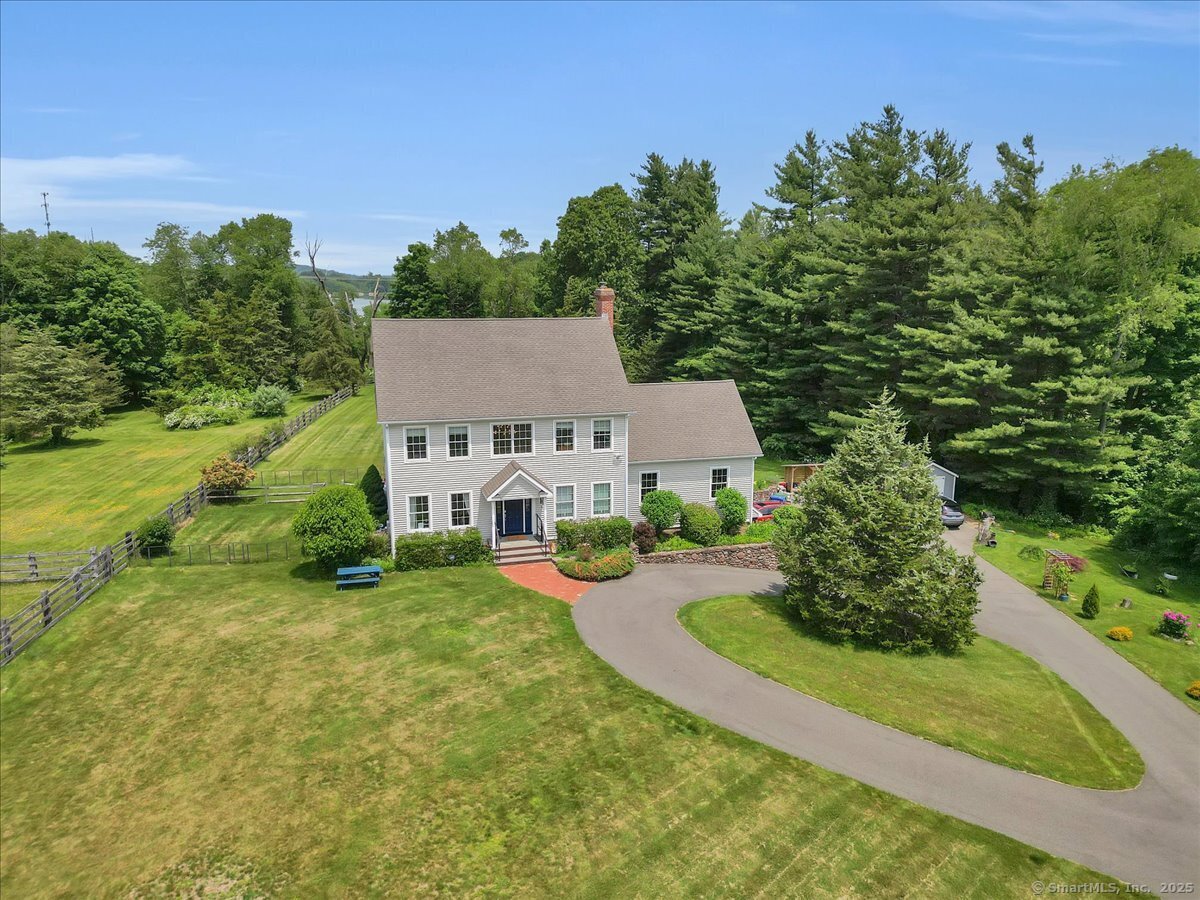 Welcome to 100 Round Hill Rd, an exquisite 2,824 sq ft home set on 3.5 acres of pristine open meadows with pampered gardens and breathtaking natural beauty. This well-maintained property offers a seamless blend of sophistication, comfort, and tranquility in one of Middletown's most desirable settings. Designed with an open concept floor plan, the home features a chef's gourmet kitchen equipped with Wolf appliances, cherry wood cabinets, granite counter tops, and a spacious center island. Wide maple hardwood floors flow throughout home, creating warmth and elegance. The open living room with vaulted ceilings provides a light-filled space perfect for gathering and entertaining. This stunning residence includes 3 bedrooms and 2.1 bathrooms. The primary suite is a true retreat, offering expansive views of the manicured backyard, a huge walk-in closet, and a private dressing room. Step outside to your own private oasis. A massive back deck extends your living space outdoors, ideal for entertaining guests, summer dining, or simply unwinding while enjoying the surrounding gardens, rolling meadow, and serene views. Located minutes from Lyman Orchards Golf Club, Wadsworth Falls State Park, and Wesleyan University, this home also provides easy access to downtown Middletown's shops, dining, and cultural venues, plus convenient routes to Route 9 and I-91. Don't miss this rare opportunity to experience peaceful, luxury living surrounded by nature. Schedule your private showing today.