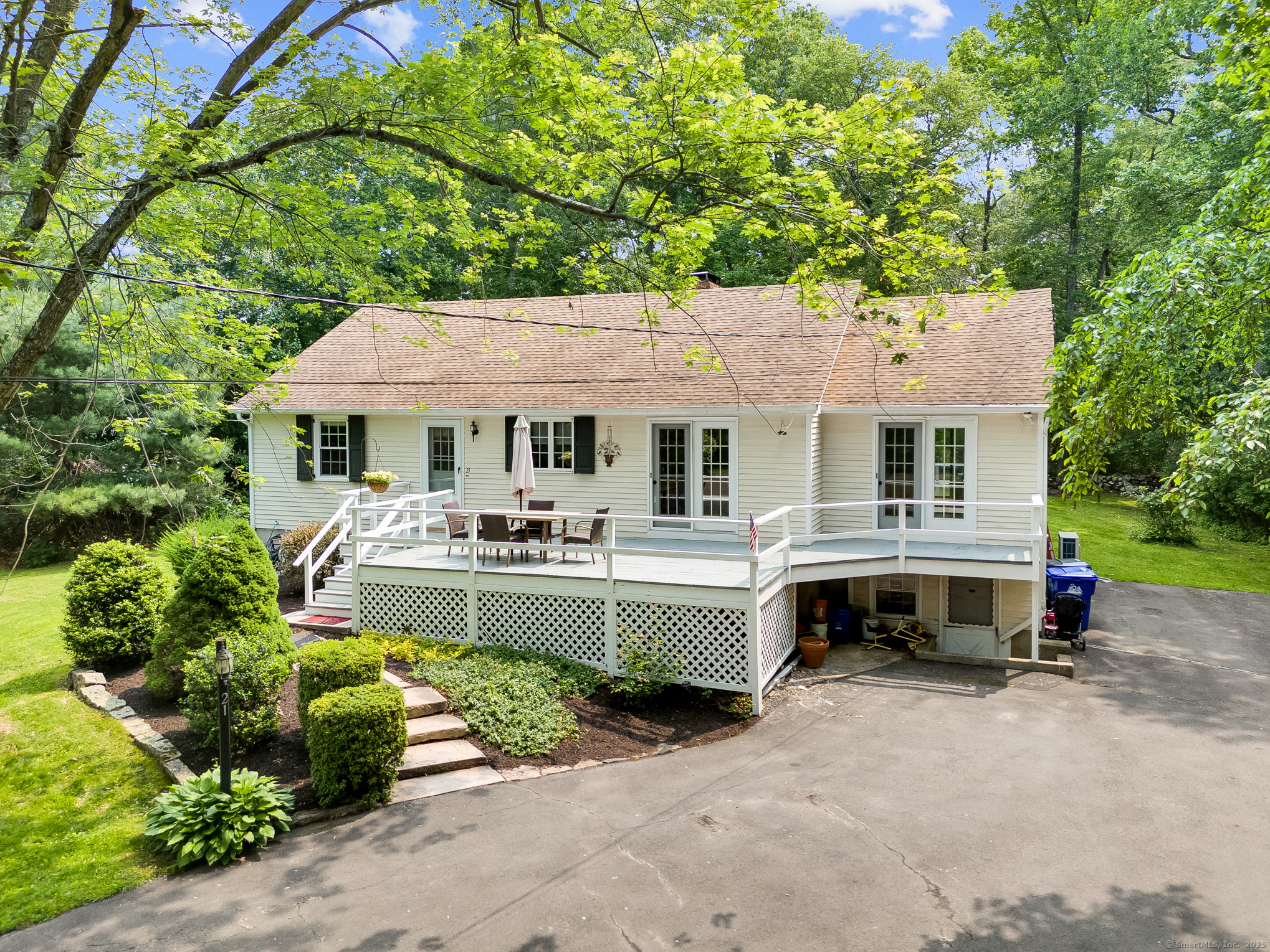 Calling all (wanna be) Creekers!! Welcome to this classic Stony Creek gem! Nestled on *just* shy of an acre and set back from the road, this charming 2-bedroom, 2-bathroom ranch offers the perfect blend of character, privacy, and convenience. Inside, you'll find beautiful wide plank pine flooring in the formal dining room, living room, and formal living room, with hardwood floors throughout the bedrooms. The bright and spacious living room features a cozy knotty pine accent wall, along with two sets of French doors and a sliding glass door that open to both front and rear decks-perfect for enjoying the peaceful surroundings and frequent visits from local wildlife. The primary suite includes a private full bath, and the second full bathroom was fully renovated in 2023. The basement is already heated and offers great potential for finishing into additional living space. Additional highlights include: Roof approximately 10 years old, Updated windows, Central air updated in 2021, Single zone high efficiency heat pump/AC. 3 zone oil baseboard. Heat pump hot water heater doubles as dehumidifier. Located less than one mile from the charming Stony Creek Village, beach, and docks, and just steps from the scenic memorial preserves and historic Stony Creek Quarry, this home offers the perfect opportunity to enjoy all that this beloved shoreline community has to offer. Don't miss your chance to own a piece of Stony Creek!