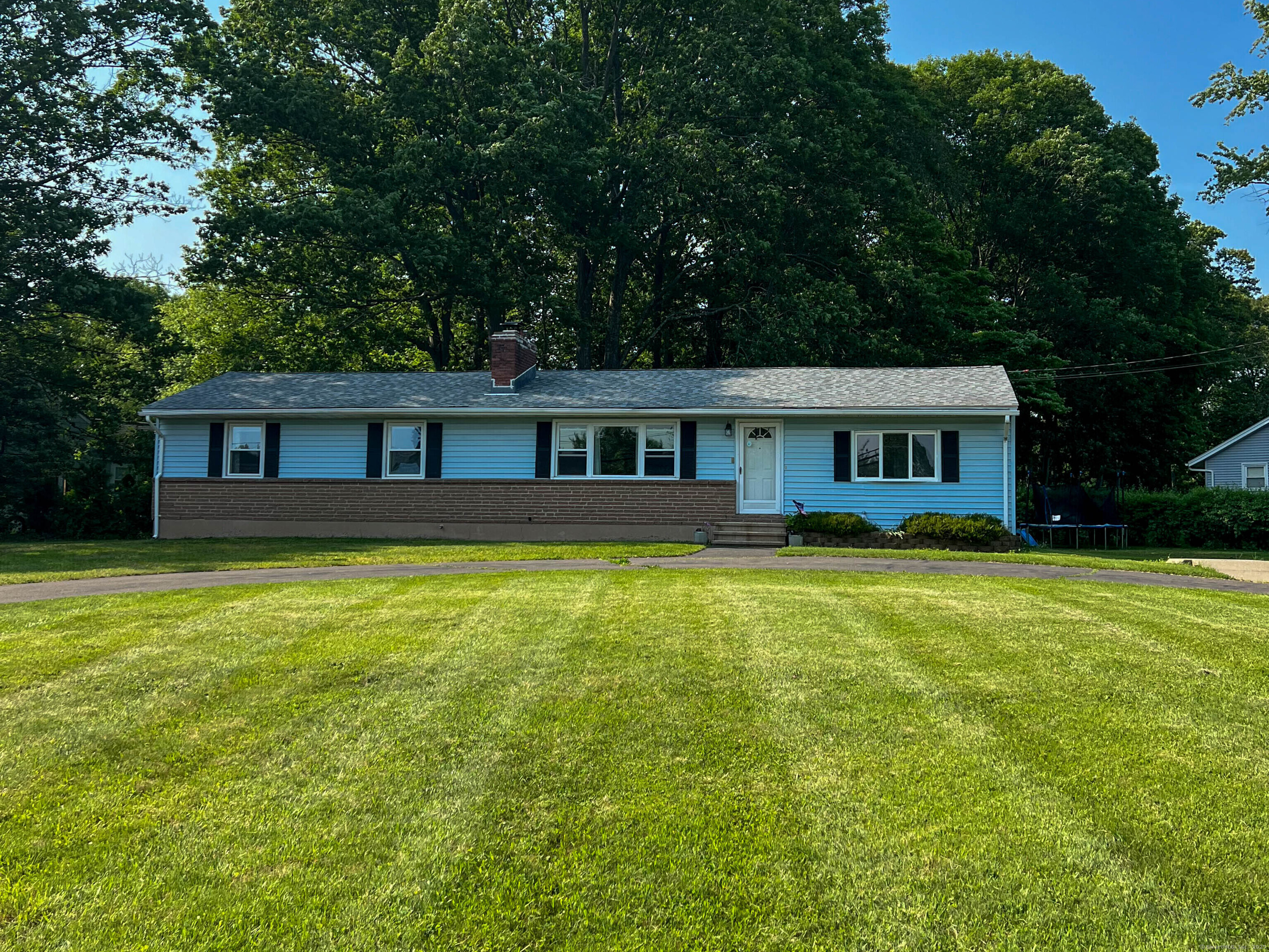 A beautifully updated and expanded ranch-style home nestled in one of Wallingford's most peaceful and sought-after neighborhoods. This thoughtfully designed 3-bedroom, 2-bath residence offers 1,430 square feet of bright and inviting living space on a generous 0.45-acre corner lot. At the heart of the home is a beautifully renovated open-concept kitchen featuring modern cabinetry, sleek stone countertops, high-end stainless-steel appliances, and an expansive center island-ideal for casual meals or entertaining guests. Designed with both style and functionality in mind, the kitchen effortlessly opens to the spacious living and dining areas, creating a warm, inviting space perfect for everyday living and social gatherings. Gleaming hardwood floors run throughout the main living areas, and the primary bedroom features its own private full bath. A second remolded full bathroom is conveniently located off the main hallway to serve the two additional bedrooms and guests. The full basement offers incredible potential, providing ample space for storage and the opportunity to be finished into additional living space to suit your needs. Whether you're seeking a home that's ready to move in or a space with room to grow, this house offers the perfect combination of modern updates, functional design, and future potential, making it a must-see!