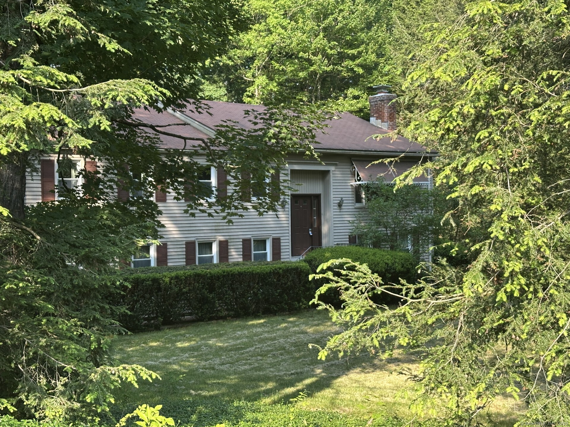 Welcome to this charming one-owner, 3-bedroom home nestled in the desirable Mountain Farms neighborhood of West Simsbury. Lovingly maintained, this home features beautiful hardwood floors, central air conditioning, a walkout lower level with a sunroom, and a private backyard-perfect for relaxing or entertaining. Conveniently located near shopping, local restaurants, parks, hiking trails, and a neighborhood elementary school, this home offers both comfort and convenience. Situated in an award-winning town with easy access to NYC and Boston, this is a wonderful opportunity to make this home your own.