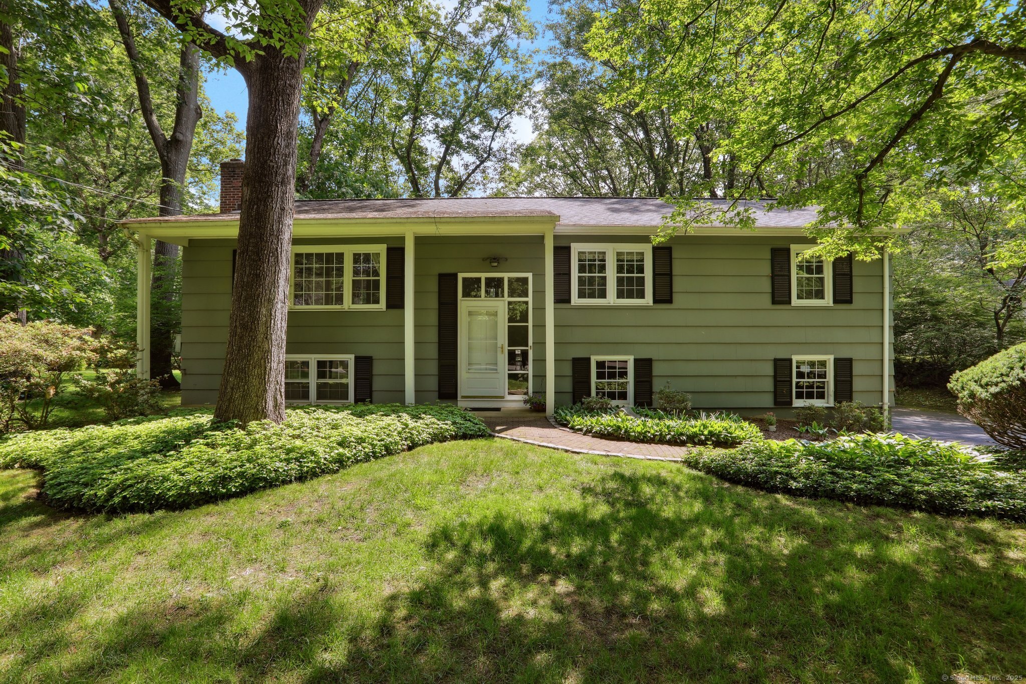 Welcome to this beautifully maintained Raised Ranch nestled on a serene, level half acre lot, this 3 bedroom, 2.5 bath home offers the perfect blend of comfort, space and convenience. Inside, you'll find a warm and inviting layout with generous living areas, a functional eat -in kitchen open to the dining room and living room....great flow for daily living. The primary bedroom features it's own private bath, while the additional bedrooms are the perfect fit for family, guests or a home office. The finished lower level adds valuable finished living space, perfect for a family room, play space, flexible options and endless possibilities. The lower level also provides an bonus room with ample closet space, which can be used for a home office, guest space or recreation, a half bath and dedicated laundry room. There is direct access into the lower portion of the home from the attached 2 car garage and easy access to the private backyard via sliders - perfect for recreation and entertaining. This home is just minutes from all your daily needs, including lifestyle amenities like Cranbury Park, Calf Pasture and Shady Beach. This home has been lovingly maintained by the same family for over 50 years! Located at the end of the street on a desirable cul de sac, come see all it has to offer today!