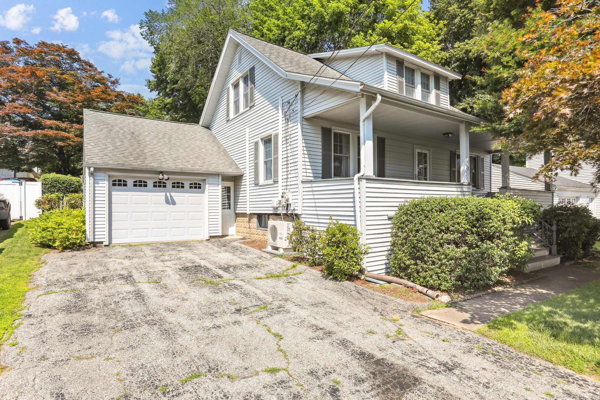 Immaculate & nicely updated, this 3 bedroom cape is what you've been waiting for! Its welcoming front porch is a nice shady spot to relax on a hot summer day. The spacious living room provides nice entertaining space for family & friends, & the gas fireplace warms up cold winter nights. The dining room is perfect to host holiday dinners,& there are gleaming hardwood floors throughout the main level. The nicely updated eat in kitchen has sparkling white cabinetry, & Corian countertops. It opens to a large breezeway, with a wall of windows overlooking a beautiful, private backyard. The stone patio is a great spot for a Bar-B-Que! Upper level has three nice sized bedrooms, with wall to wall carpet. Primary bedroom has a large W/I closet, and the remaining two bedrooms share a large W/I closet. A real plus is that there are two other walk in closets on this level, so plenty of storage space! Full hall bath has also been remodeled, with nice tile floor, & subway tile tub/shower surround. Both levels are cooled with split system A/C. The garage has a walk up loft, for additional storage space. This home is in good condition, well maintained, and being sold As Is. The home is conveniently located to schools, shopping, great entertainment & dining,& is great for a New York commute! You'll also love Tarrywile Park, with its 21 miles of hiking trails, 2 ponds, a lake, and several picnic areas.  A beautiful outdoor space, just a short walk from your new home!