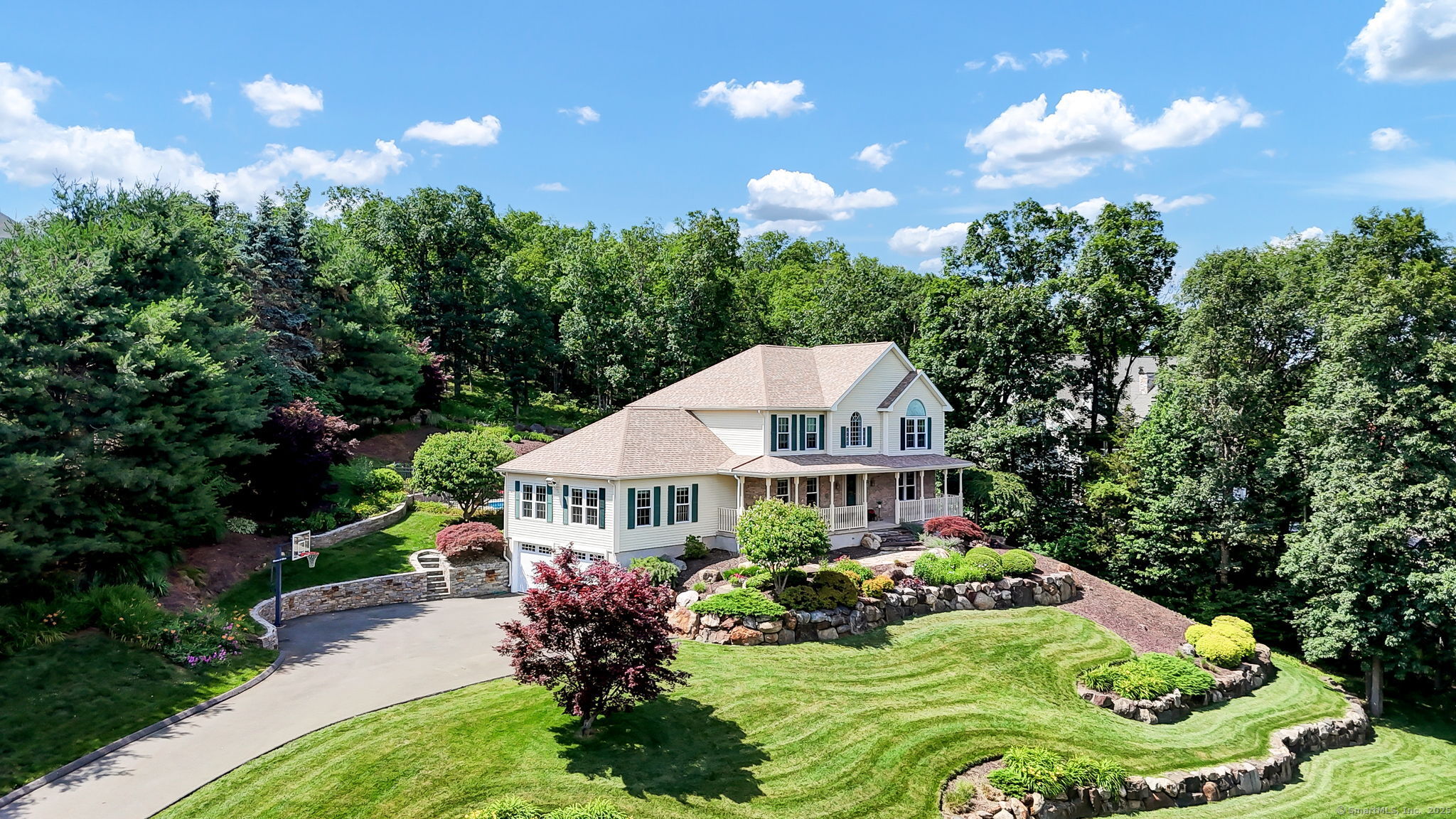 Welcome to one of the most captivating homes in Berlin - a custom-built, luxury retreat perched atop the sought-after Lamentation Mountain neighborhood. With over 2,900 square feet of pristine living space, this 4 Bedroom + office, 2.5-bath masterpiece blends elegance, comfort, and function in perfect harmony. From the moment you arrive, the professionally landscaped grounds and striking stonework set the tone for something truly special. The curb appeal is unmatched - a grand front porch stretching over 50 feet invites you to take in panoramic views of the Berlin Valley. Set high on a hill, this home offers a rare vantage point that brings both privacy and a daily dose of awe. Inside, you'll find rich hardwood floors with elegant inlaid borders and luxurious custom trim work that wraps throughout the entire home - a level of craftsmanship that adds timeless sophistication to every room. The layout flows seamlessly with a formal dining room, a private study, and a vaulted-ceiling living room featuring a custom gas-log fireplace. The kitchen is well-appointed and functional, complete with a spacious island, walk-in pantry, and brand-new appliances - perfect for everyday living and hosting family and friends.