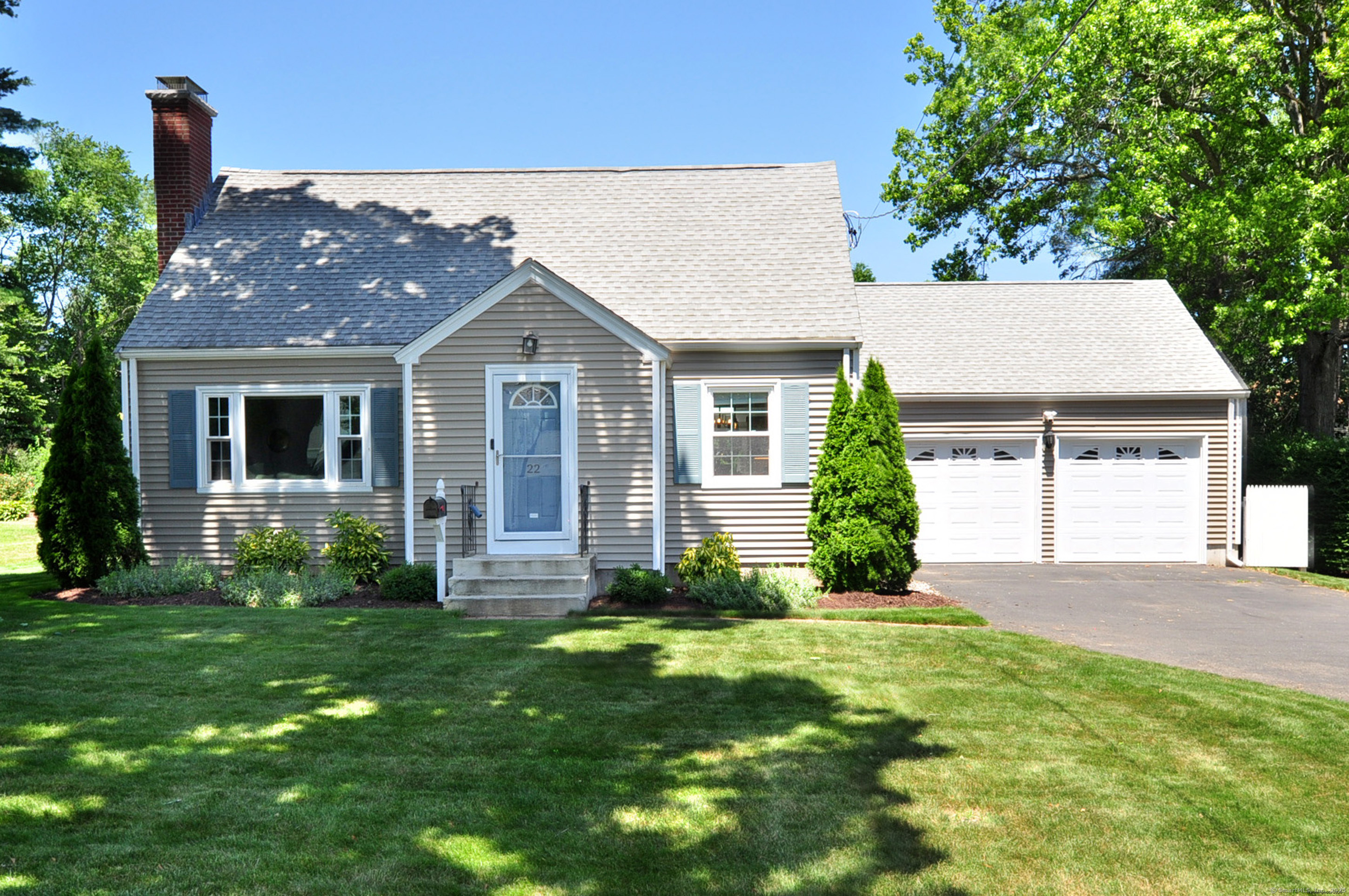 Mint condition sun-filled cape! Newer addition with first floor primary bedroom with walk in closet and amazing full bath. Transom windows is just a hint of the details that are in this home. The kitchen has been completely done! From quartz counters and a undermounted Kohler kitchen sink, a large island with seating, under cabinet lighting and a sky light. Built in wine rack, plus dovetail constructed cabinets with a soft close feature. This is a kitchen to entertain in or just hang out with a cup of coffee. The formal living room has a fireplace and hard wood floors. The open concept dining room has chair rail molding and opens to the kitchen. The lower level has a large finished open space, great for a tv room or work out space. There is also a separate new laundry room. The second floor of the home has two large bedrooms and a full bath. This is a low maintenance home, with a 6 year old roof, vinyl siding and a 3 year old Hybrid water heater. The kitchen looks out to a private back yard, a lovely patio and mature plantings. It is a short distance to Blue Back square and all that the town center offers.