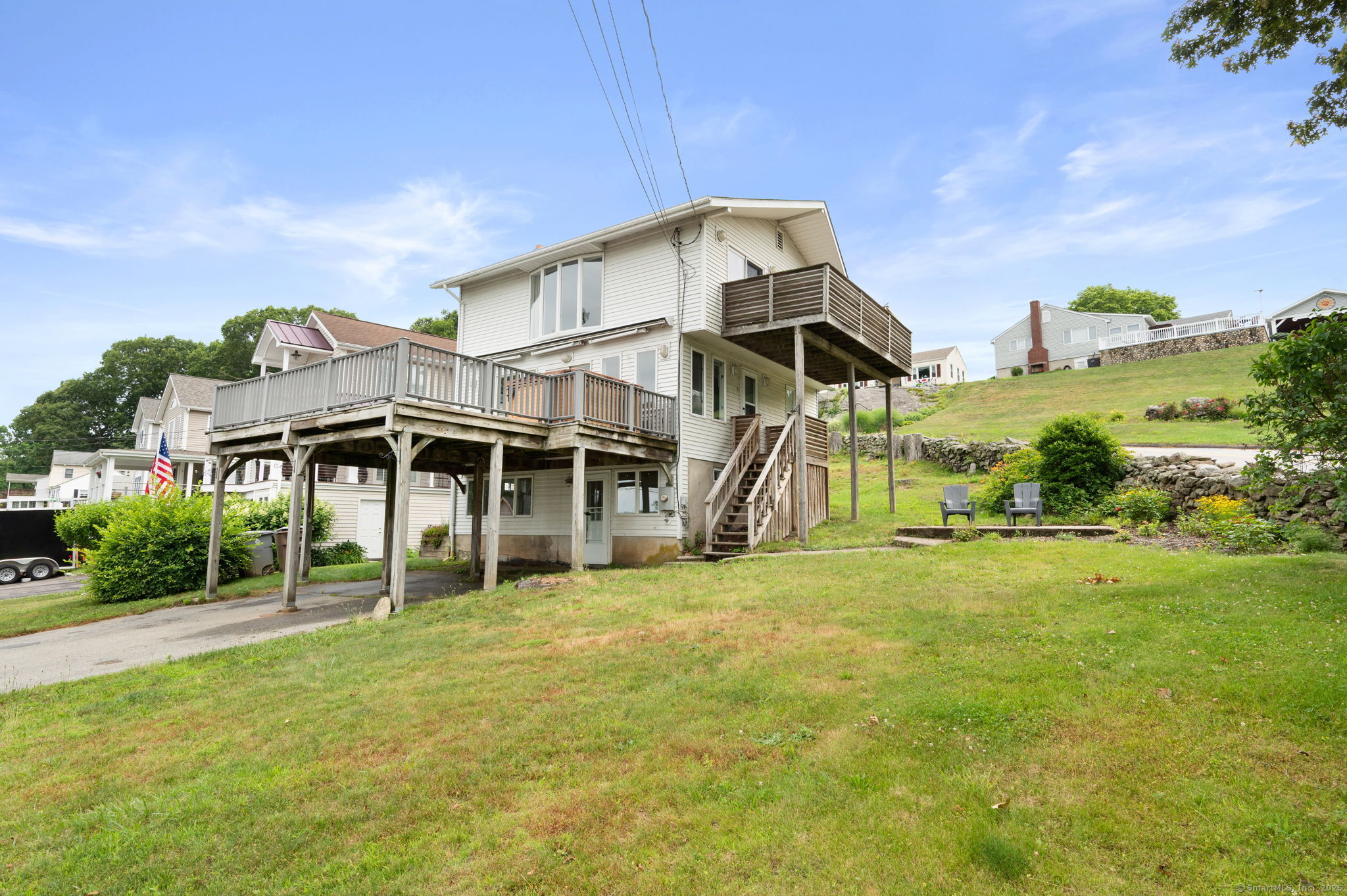 Beach living at Giants Neck Heights... updated and views from every room of Long Island sound. The open floor plan starts with family room add a woodstove for cozy nights and guest suite. Main level has the Living room open to Dining area, newer kitchen and breakfast bar, all leading out to a generous size deck and hot tub. Continue up to the master suite on the upper level with its own private deck. Enjoy life in this private beach community that offers a clubhouse for private parties, boat launch and playground. The village of Niantic offers, restaurants,marinas, SE CT young people  museum and great shopping. Minutes to the train or highway to Boston and New York City.