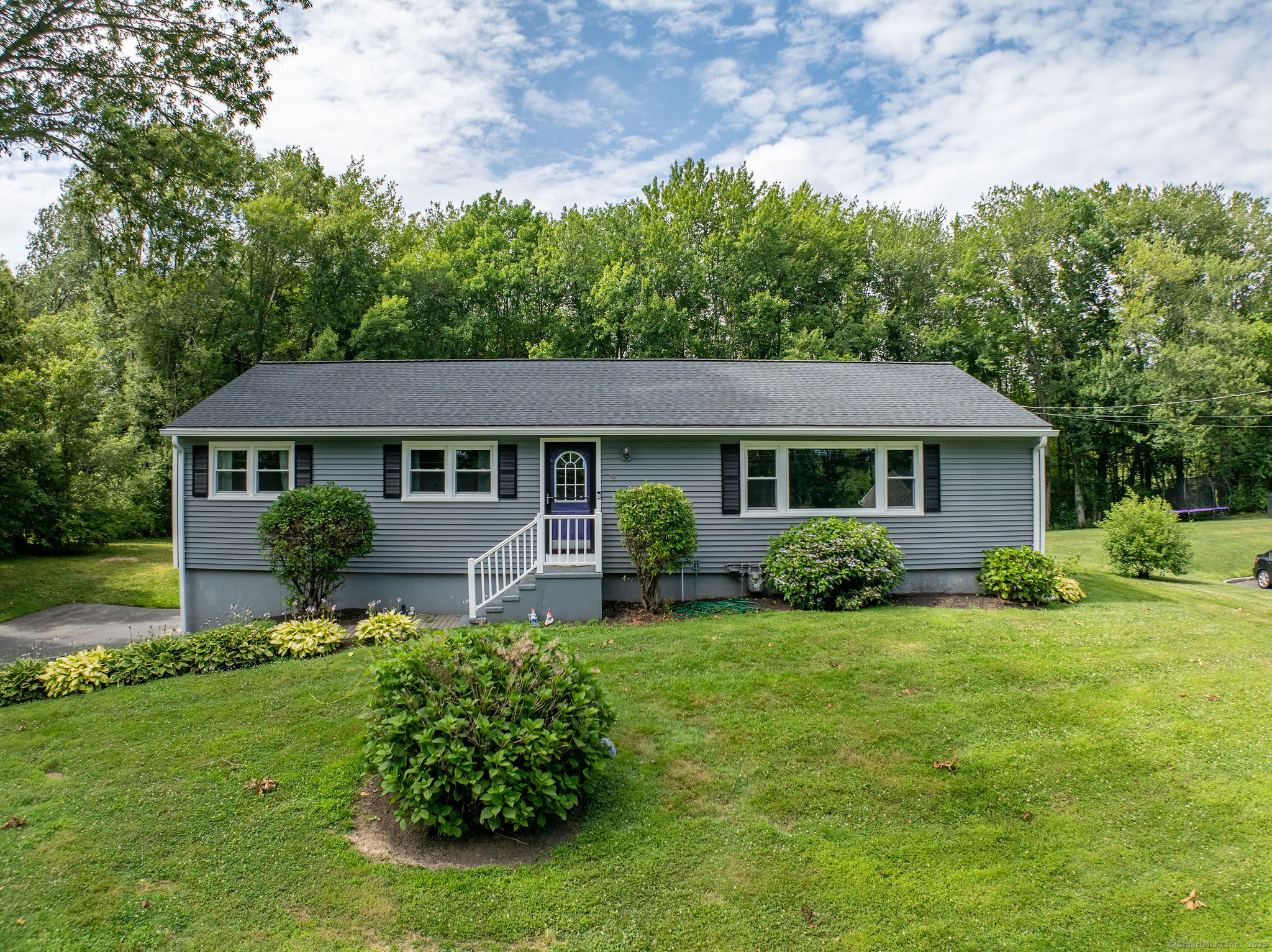 Welcome to this beautifully maintained 3-bedroom, 2-bathroom ranch offering the perfect blend of comfort, convenience, and coastal living. Located just one mile from Woodmont Beach, with quick access to highways and shopping, this home checks all the boxes for easy living.    Step inside to discover premium laminate flooring throughout with hardwood flooring hidden underneath, ready to be revealed or preserved. The heart of the home is a renovated kitchen (2020), designed with both style and function in mind.  An oversized living and dining room combo provides plenty of space for gatherings and everyday comfort, while a bright and airy sunroom offers the perfect place to relax with morning coffee or unwind after a long day. Each bedroom features custom built-in closet organizers, maximizing storage and organization. A Bath Fitter insert in the main bathroom adds a fresh, modern touch. Stay comfortable year-round with central air conditioning and enjoy cozy evenings by the gas fireplace in the spacious family room. The electric pet fence offers peace of mind for your four-legged friends and the attached 2-car garage adds convenience and extra storage. The unfinished basement provides excellent potential for future expansion, a home gym, workshop or extra storage - customize it to fit your needs. Step outside to an outdoor space with low-maintenance Trex railings, overlooking a heated pool-perfect for entertaining or unwinding.