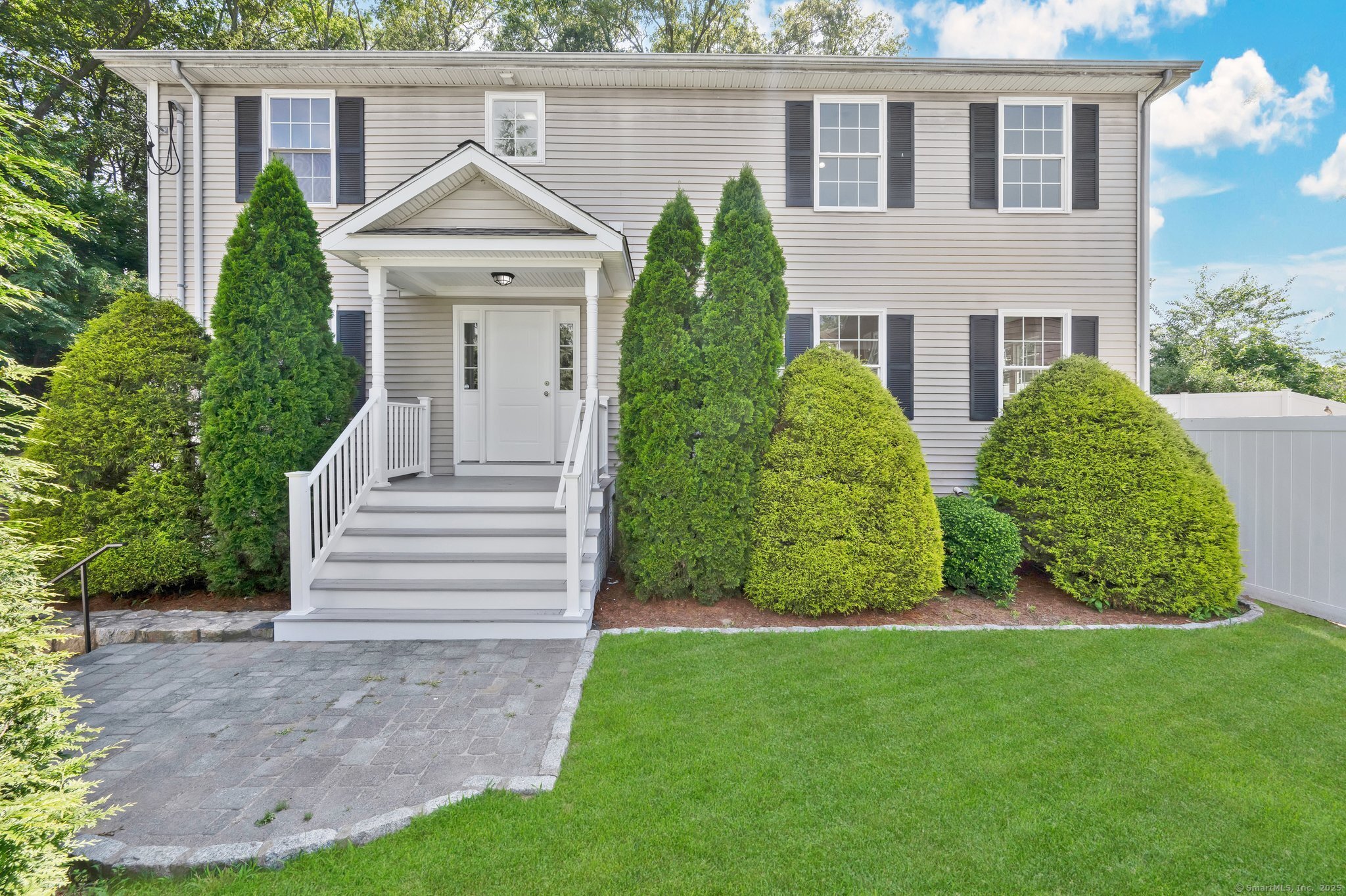 Set back from the road for added privacy, this beautifully maintained Colonial will impress with exceptional curb appeal, elegant stonework and mature landscaped plantings. Proudly offered by the original owner (builder), the residence reflects quality craftsmanship and meticulous attention to detail throughout its design and upkeep. Featuring 4-5 spacious bedrooms, this home offers flexible living and exceptional value in a prime North End location. The main level boasts beautiful hardwood floors, soaring ceilings, and an abundance of natural light through high-end Pella windows. The expansive eat-in kitchen is perfect for everyday living and entertaining which flows seamlessly into a large, open-concept family room. A versatile first-floor room can easily serve as a fifth bedroom, private office, or den. Upstairs, you'll find 4 generously sized bedrooms, including a stunning primary suite with vaulted ceilings, a large WIC and a full bath. Enjoy the two-car garage with ample storage space. Energy efficient with C/A and gas heat. Relax in the private, fully fenced in backyard with professionally designed stonework, ideal for outdoor gatherings. At one-point this was rented to SHU students for $5,000/month so the investment potential is there. Conveniently located to SHU, shopping, restaurants & major highways. This home combines comfort, location, and long-term value. Don't miss this opportunity! See agent remarks