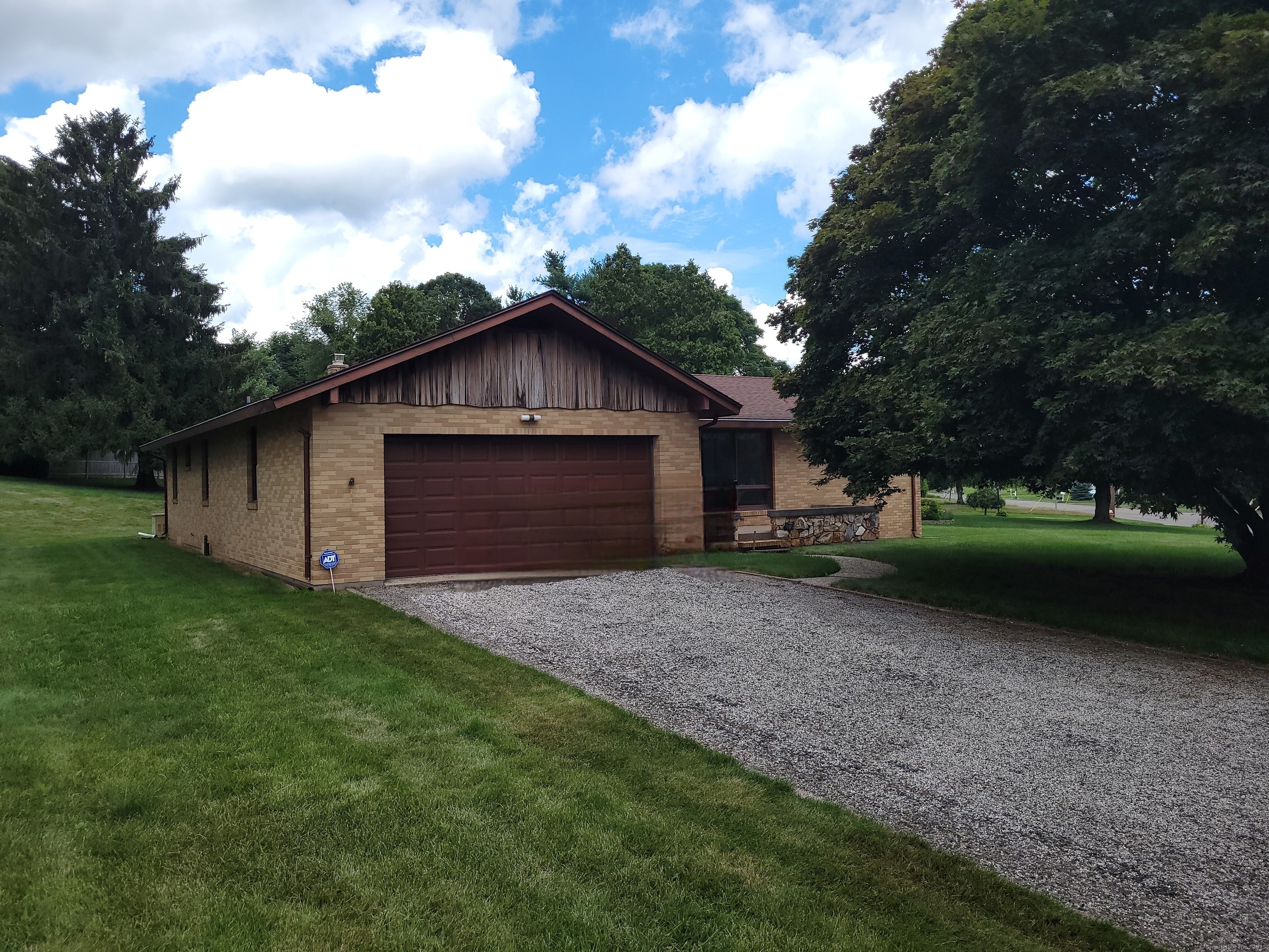Classic mid-century design is making a comeback, and 62 Rice Road has it! Why? Because this is where solid brick construction meets a modern, open design. This ranch offers 3 bedrooms, 2 full bathrooms, and a dedicated home office-ideal for today's remote work needs. The highlight of the home is the classic living room anchored by a stone fireplace complete with a large harth waiting for a modern touch. Two other fireplaces add warmth and timeless character to the expansive living areas. Not many homes of this era offer a primary bedroom complete with a full bathroom and a walk-in closet, but this home does! Enjoy the comfort of central air conditioning and peace of mind with a whole-house generator. Set on a prominent corner lot with mature landscaping, the property offers curb appeal and space to personalize. The property is in good condition overall and even comes with a 1 year home warranty. It's ready for your vision and updates to make it truly shine. Don't miss this exceptional opportunity to create your dream home in a sought-after location!