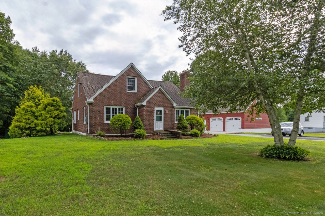 Welcome to this beautifully maintained brick Cape Cod home with modern updates and classic character. Nestled in a convenient location just minutes from shopping and major highways, this spacious home offers comfort, versatility, and style. Step inside to find a large, updated kitchen featuring an island, abundant cabinet and counter space-perfect for cooking, entertaining, or gatherings. The first floor offers flexibility and function, with a bedroom, full bath and an addition room that is ideal for a home office, playroom or den which also includes laundry hookups. The living room invites you to relax by the fireplace, while original details like mahogany arched trim, staircase, and foyer showcase the home's classic charm. Upstairs, you'll find four additional rooms and another full bath, offering ample space for bedrooms, guest rooms, or hobby areas. The town records indicate this a 3 bedroom home, but it could certainly be utilized as 4 bedrooms. Upgrades include: 200-amp electrical service, lifetime warranty windows, lifetime architectural shingle roof, boiler in 2019 and a 330 gallon oil tank. A major bonus is the impressive 24' x 36' detached garage (built in 2009) with an unfinished upper level accessible by its own staircase-ideal for storage, a studio, game room or future expansion. Don't miss your chance to own this unique, well cared for home with a perfect blend of history and modern convenience. Schedule your showing today!