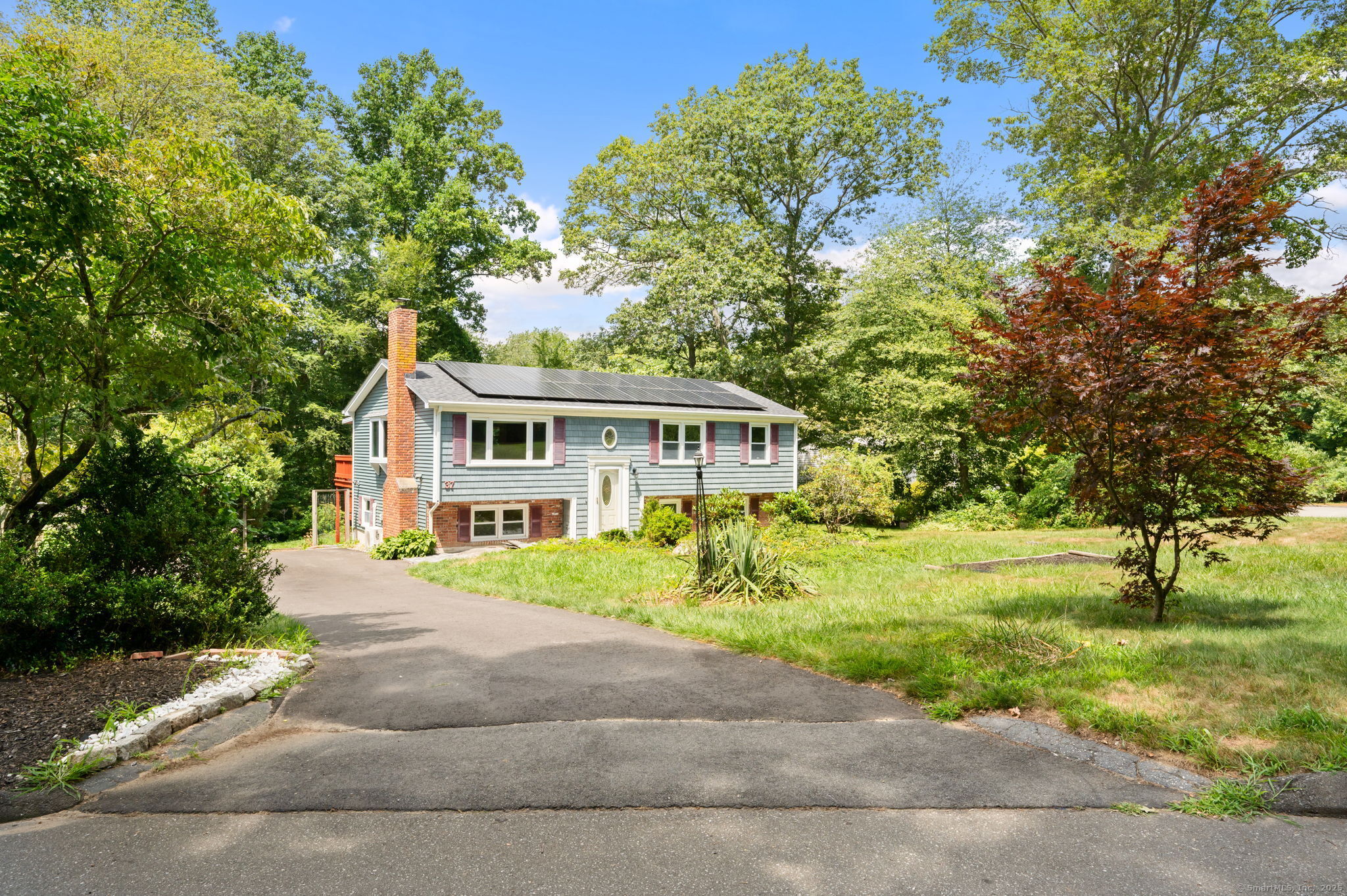 Welcome to 37 Stoneywood Dr, nestled in the heart of a lovely, tree lined neighborhood in Niantic, CT. Step inside to find a freshly painted interior in this very spacious Raised Ranch home. Boasting over 1,800 sq ft., this 4 bedroom home has room for everyone. Open concept floor plan, beautiful hardwood floors, mini-splits for year round comfort, slider to multi-level back deck and above ground pool. Lower level features the 4th bedroom, a large family room with new luxury vinyl flooring and fireplace, half bath with laundry and additional room for an office, 5th bedroom or just storage. Roof 3 yrs, windows 10 yrs, solar panels (to be transferred to buyer) 3 yrs. Beautiful yard with contained garden area and backyard privacy. Convenient to major highways, beaches, downtown shopping and restaurants.