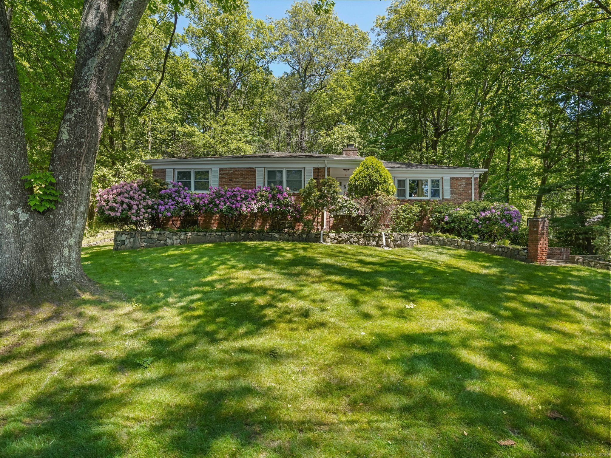 Welcome to easy living in this updated, freshly painted Westover Ranch, ideally located on a quiet cul-de-sac. Generously sized rooms and a finished lower level offer plenty of flexible space. The main level features a sunlit Living Room with fireplace, spacious Dining Room, and a refreshed Eat-In Kitchen with new quartzite counters, center island with breakfast bar, and sliders to the rear yard and expansive patio-perfect for outdoor entertaining. A cozy first-floor Family Room completes the main living area. The Primary Bedroom includes a walk-in closet and an updated en-suite Bath with tumbled marble flooring and separate shower. Two additional well-proportioned Bedrooms share a beautifully redone Full Hall Bath with marble tile floor, all on the main level. The finished lower level impresses with a large Playroom with brick fireplace and high ceilings, plus an Office, Den, and a Half Bath with marble tile. The oversized 2-Car Garage houses the Laundry area, complete with newer washer & dryer. Additional highlights include an EV charger and City Water-all just minutes from shopping, schools, and major commuting routes. This is the perfect blend of comfort, convenience, and value in one of Westover's most desirable neighborhoods.