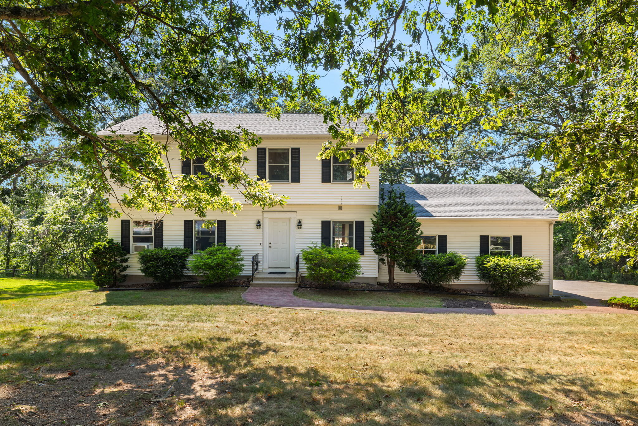 First time on the market, this 1944 sq. ft. Colonial Home located on a cul-de-sac, in Niantic has so much to offer. Hardwood floors compliment the main level. Renovated Kitchen featuring maple cabinets and a granite countertop flow into the Dining Room area with bow window overlooking a scenic back yard. Family/TV room is accented by a brick fireplace with a French door leading out onto a deck with views of Gorton Pond. Living Room is in the front of the Home off the main entry. A half bath and laundry area are adjacent from the 2-car garage. This completes the main floor living space. Upstairs you will find the Primary BDRM suite with walk-in closet, full bath with stall shower and plenty of closet space. Two additional BDRMS and a full bath finish the upper level. Basement is just waiting to be finished, having endless possibilities with walk-out basement. New roof installed 10 years ago. Located in a desirable neighborhood in Niantic, home offer the perfect balance of tranquility and convenience. With easy access to major highways, shopping and dining. This amazing home can be yours, schedule a showing today!