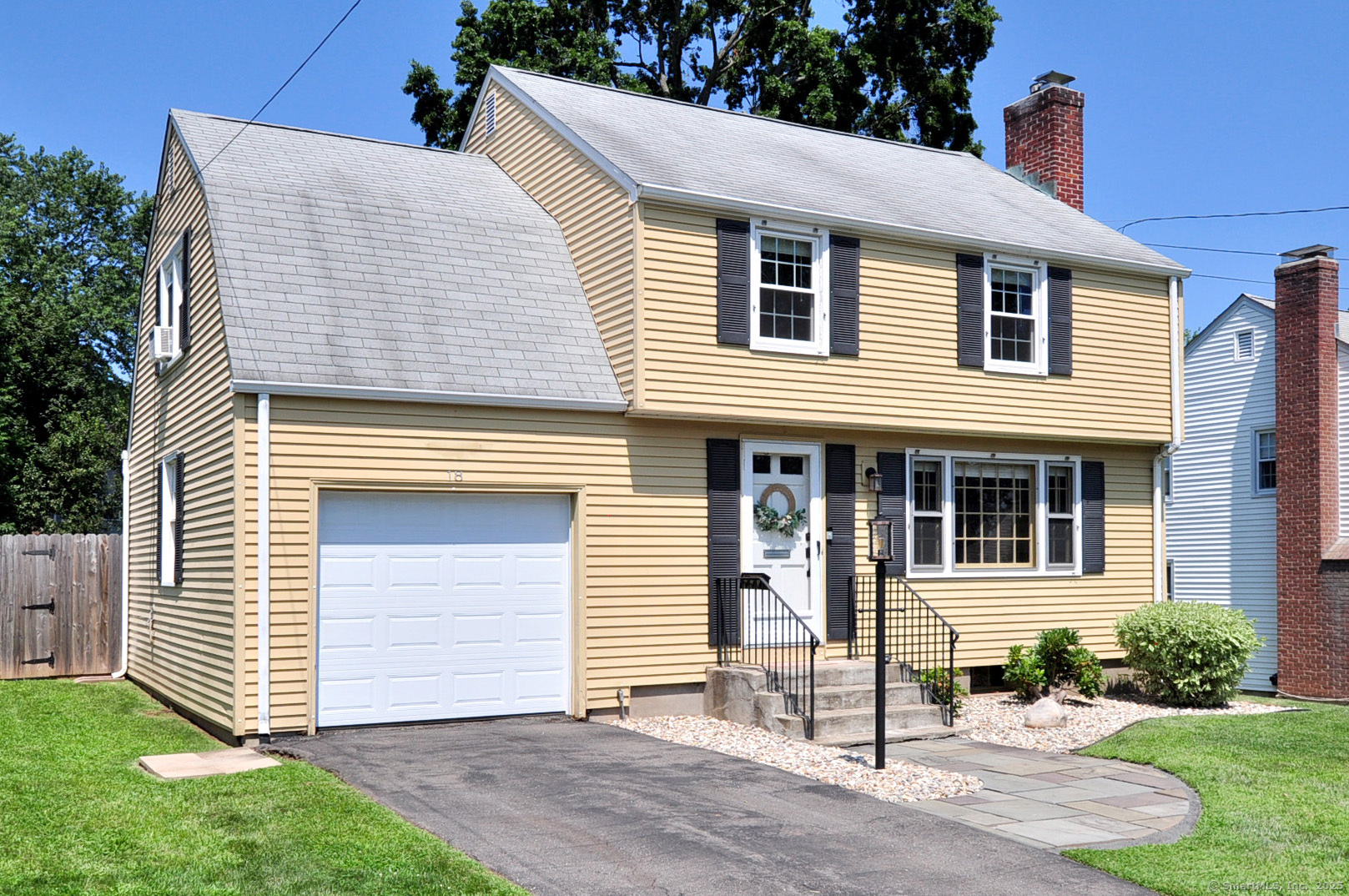 Move in with summer left to spare, welcome home to 18 Greystone Road! Located in a welcoming and walkable neighborhood, this cozy 3-bedroom colonial does not lack in charm. You'll find endless natural light spilling onto the hardwood floors throughout. Ample space in the living room is centered by a wood-burning fireplace, connecting both the kitchen and dining room to make a convenient and classic layout. The upper level offers three spacious bedrooms, with the primary bedroom particularly oversized. The lower level offers additional space that could easily be finished. The enclosed porch is full of opportunity, showcasing one of the best features of the home, the incredibly expansive and lush yard! Screened and private with a pressure-treated spruce fence, the yard is perfect for gatherings and/or pets to play safely. This opportunistic property is large enough to construct an addition in the rear and still have a considerable yard, if desired. Beyond the detail of the home, the location is wonderfully close to West Hartford Center (just over a mile!), Rockledge Golf Course, Webster Hill School, ample parks and shopping. This home is perfect for experiencing all that West Hartford has to offer. Agent/owner