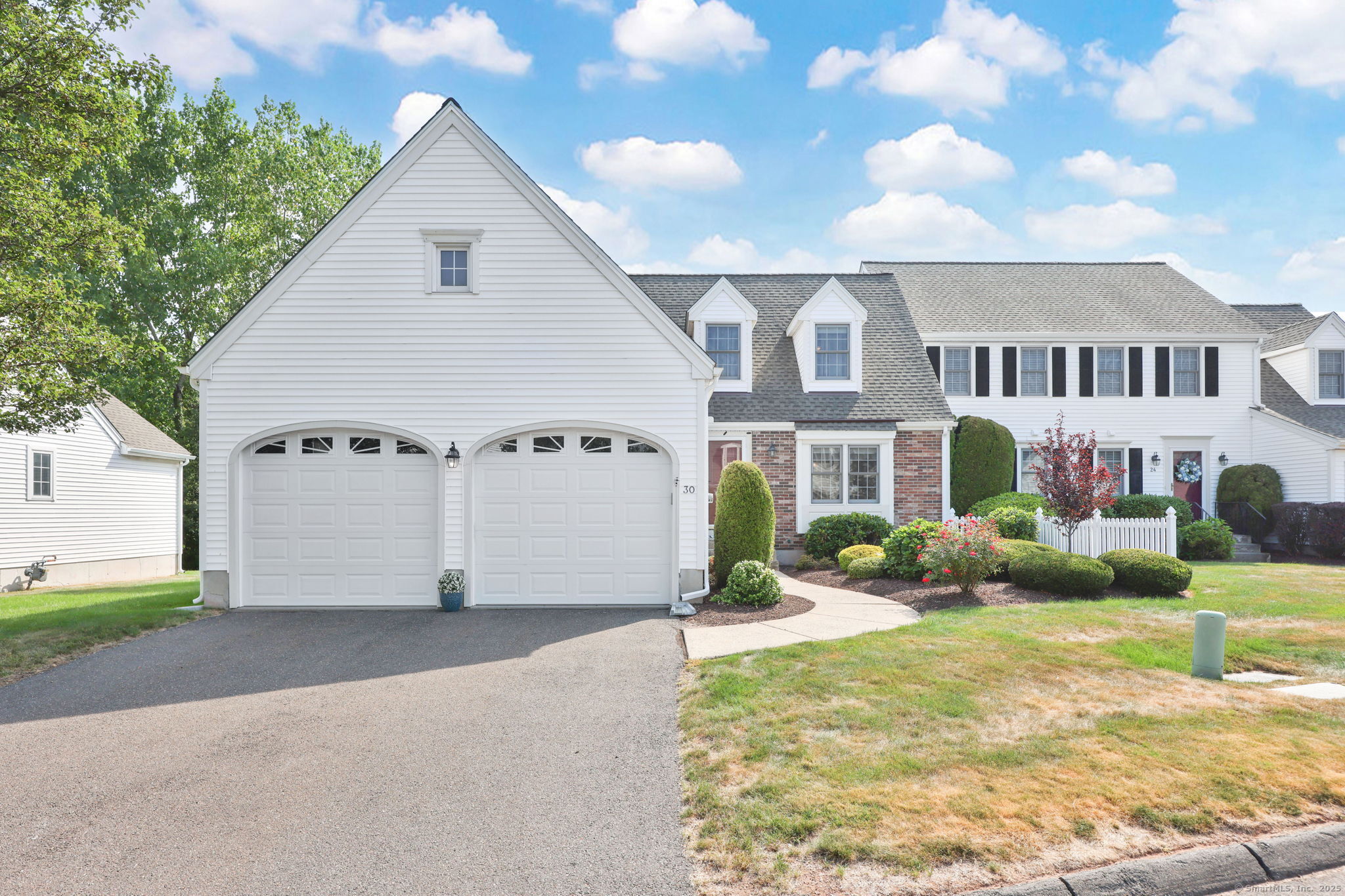 Light-Filled, Sought-After Collier Farms Cape w/Vaulted Ceilings, Deck & Low Maintenance Living! This beautiful semi-attached Cape Cod-style home offers the perfect blend of style, comfort, and convenience-with no age restrictions. Step inside to a sun-filled eat-in kitchen with sleek granite counters and tile flooring, opening to a dramatic living room with soaring vaulted ceilings, skylights, and a cozy gas fireplace. The open dining area flows seamlessly to your private deck-perfect for morning coffee or evening entertaining. Your first-floor primary suite is a true retreat, featuring three closets and a private en-suite bath. Upstairs, you'll find two spacious bedrooms with comfortable carpeting, a large full bath, and a versatile 11x20 loft-ideal for a home office, den, or hobby space. There's even unfinished space over the garage for your future dream room! Enjoy the beauty of professionally landscaped grounds without the work-grounds maintenance, snow removal, and property management are all included. Additional highlights include gas heat, central air, thermopane windows, a newer roof, and low-maintenance laminate floors on the main level. The oversized 2-car garage, full basement, and lush, private backyard with deck add even more value. School bus stops right at the corner! This home is move-in ready and waiting for you-schedule your showing today and fall in love!