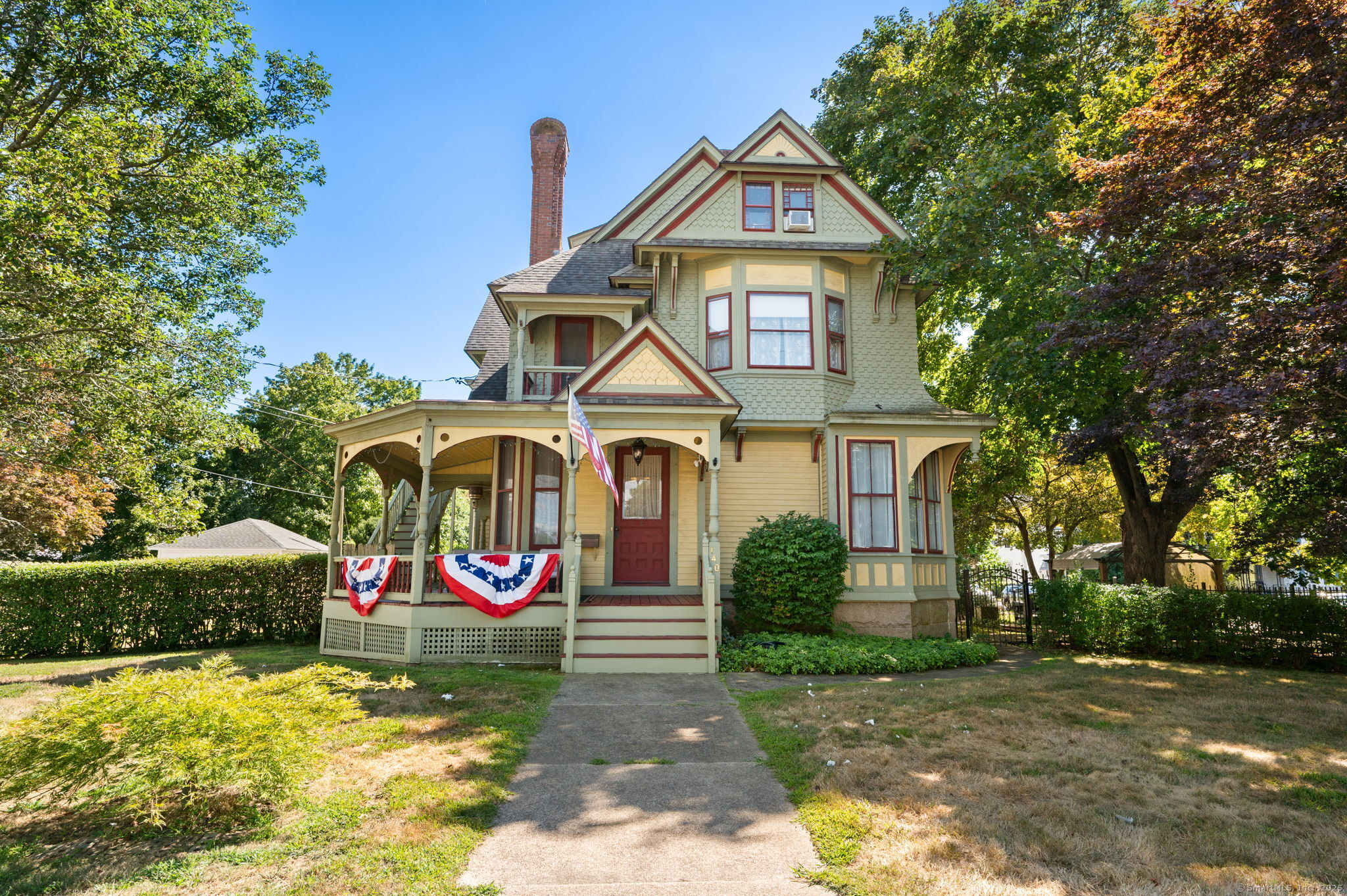 TIMELESS ELEGANCE MEETS MODERN COMFORT in this stunning 1887 Victorian. Designed and built by Charles Eastlake, this gracious home showcases craftsmanship and character of a bygone era. Beautiful wood floors, soaring ceilings and intricate woodwork blend seamlessly with the comfort of modern living. Fireplaces in both parlors provide cozy focal points blending warmth and tradition with architectural beauty. The recently updated kitchen is the heart of the home with premium finishes and stainless appliances while respecting the home's historic essence. The second floor features 3 bedrooms (one of which is en-suite) including a 1-bedroom apartment with 2 separate entrances. In one of the two fenced in side yards lies an outdoor living space with covered deck and privacy in the heart of the vibrant community. This Victorian has been well cared for by current and former owners for many years. There is a tenant with a separate entrance with a month to month lease. Original detail throughout except for a Chef's Kitchen added 2020. Yankee Gas has an easement in sw corner of property.