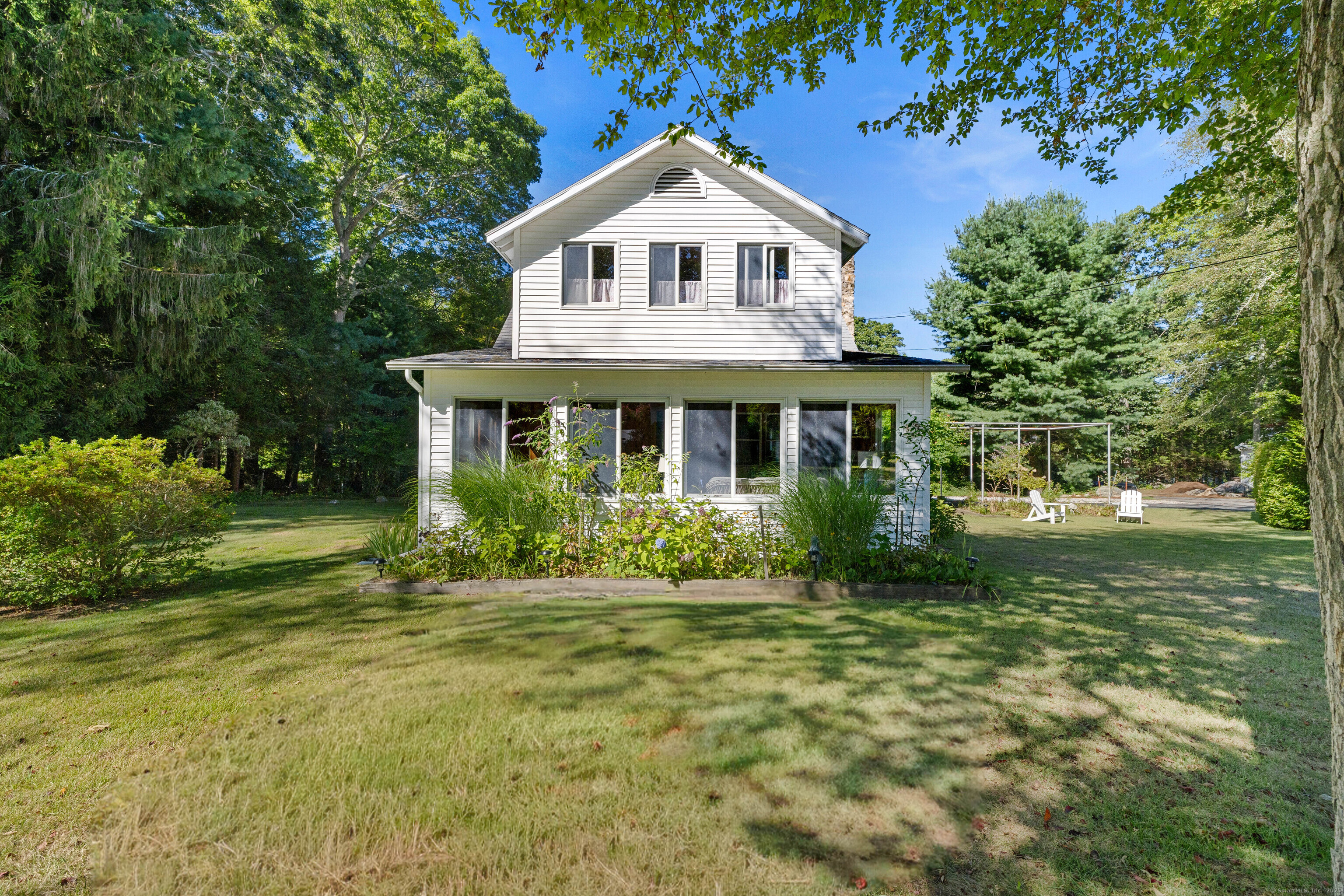 If you are yearning for the "beach vibes" of long ago, this certainly is the property for you to make your own memories with.One of the original Black Point Beach Club Association properties that has been owned by the same family for over 40 years is now looking for a new family that will love what Black Point offers: multiple beaches, tennis courts, summer camp program, a gourmet store, kayak racks both on the Bay side and Estuary, a clubhouse, boat launch and amenities for making the most of the community lifestyle. This properly is a clean slate for making it into your own. There is a large building that is wonderful for storage with an upstairs as well and perhaps could become an artist studio or office space. The town states that the home has 3 bedrooms. The upstairs porch is used as such; dormitory style. One full bath up and one full on the main level with laundry. An outside shower is fabulous. There is an arbor, a poured floor waiting for a greenhouse and a lovely lot allowing for expansion or family lawn games