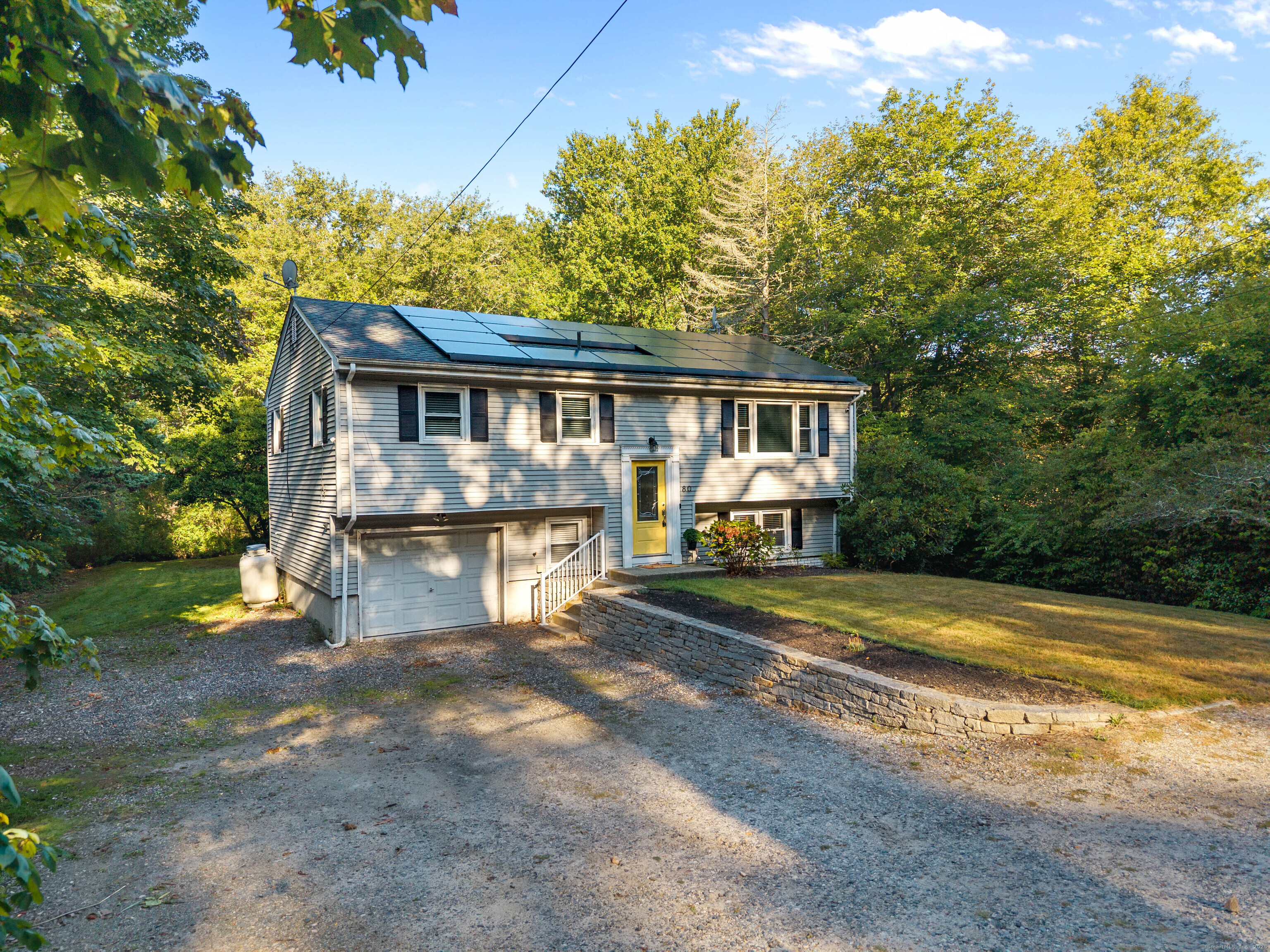 Welcome to this charming raised ranch, ideally situated half a mile from downtown Niantic! This home offers a perfect blend of comfort and convenience. The main level features stunning wood floors that flow through the bright and airy living room, dining area, and two of the bedrooms. The spacious living room is perfect for relaxing or entertaining, and the adjacent dining area leads to a deck overlooking the private backyard. The lower level provides additional living space that can be used as a family room, home office, or gym. Also on the lower level, a second full bathroom and the third bedroom which has a generous sized closet. The one car garage adds another check to that wish list.  Step outside and enjoy the best of Niantic living, with downtown shops, restaurants, and the boardwalk just a stones throw. Don't miss this opportunity to own a beautiful home in a highly desirable location!