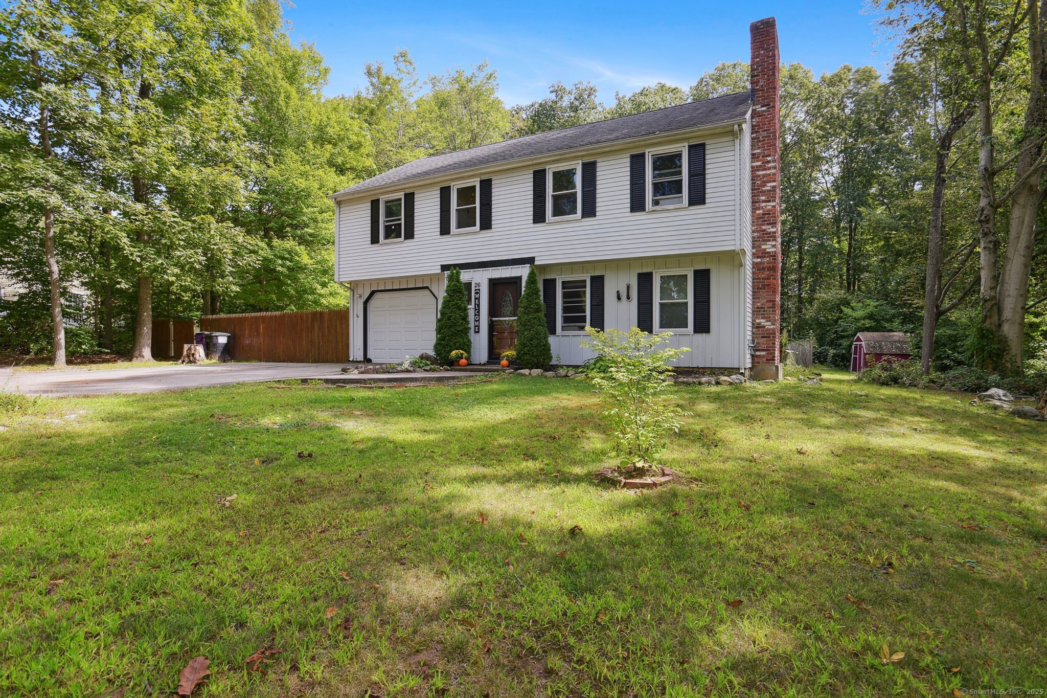 Welcome to 26 Longate Road in Clinton, a home that offers the perfect balance of comfort, convenience, and potential. This three-bedroom, one-and-a-half-bath residence with an attached one-car garage is set on a generous level lot that provides both space and privacy. The exterior gives a sense of possibility, offering plenty of room for play, gardening & entertaining, while still leaving space for your vision. Stepping inside, the home opens into a spacious and welcoming living room where hardwood floors create an inviting foundation and natural light fills the space through newer Thermopane windows. This area serves as the heart of the home and is large enough to accommodate multiple seating arrangements and the wood stove not only enhances the atmosphere but also provides supplemental heat. From the living room, the home flows easily into the kitchen and dining space, where functionality meets opportunity. The kitchen offers plenty of room to design and update to your style, and its layout is complemented by direct access to the backyard through sliding glass doors. These sliders open to a spacious deck that overlooks the backyard and provides a perfect vantage point of the in-ground pool. The main level of the home has 3 ample bedrooms, and a remodeled full bath serves them. Adding to the home's versatility is the finished lower level, with its own walk-in entry, half bath, laundry & walk out family room with another wood stove. There is also direct access to the garage.