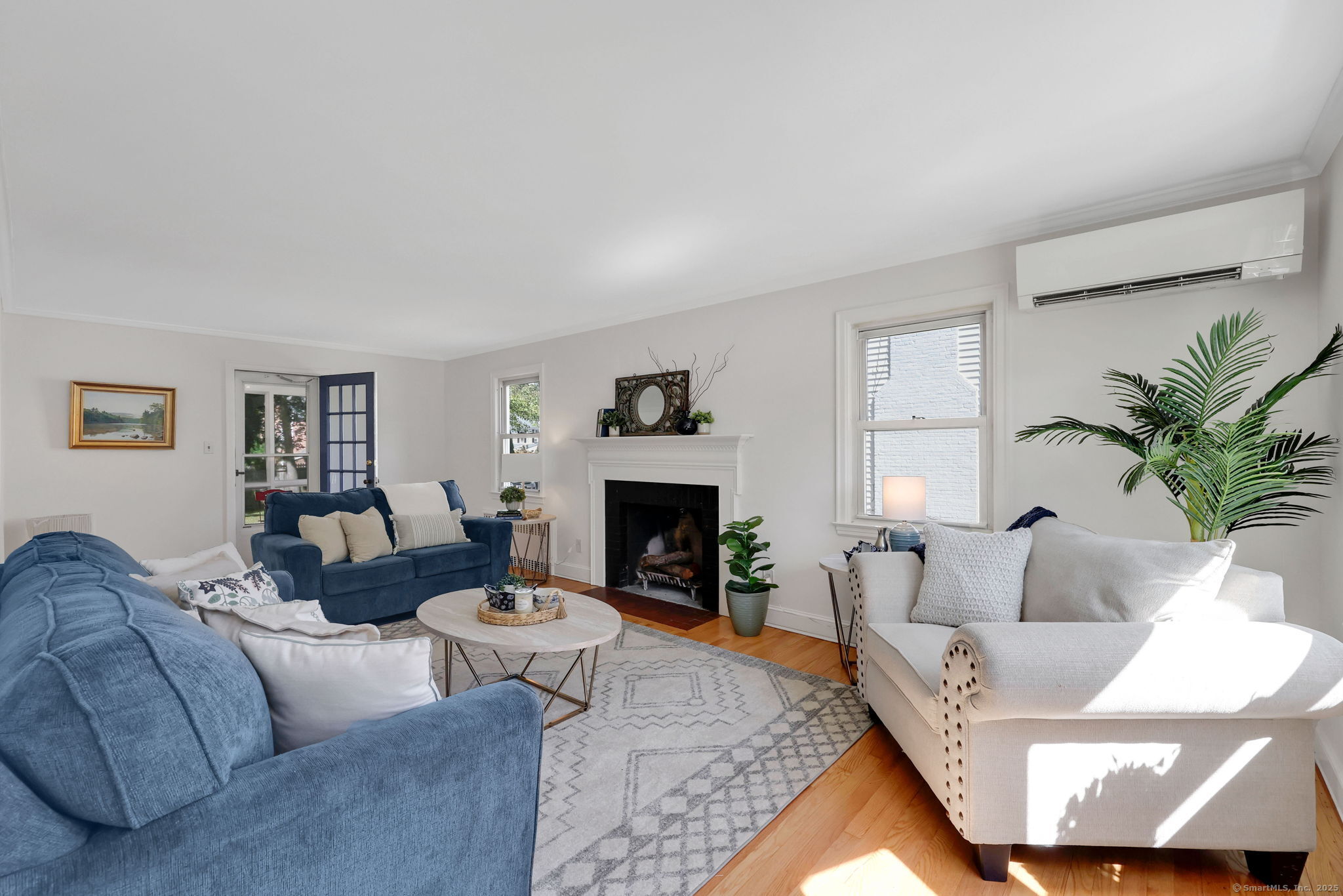 Discover comfort, character, and efficiency at 632 Park Road, a move-in-ready 3-bedroom Colonial perfectly located minutes from West Hartford Center, Blue Back Square, and Park Road's vibrant restaurants. Surprisingly peaceful inside, this well-insulated home blends 1940s charm with smart updates for today's lifestyle.  Enjoy freshly refinished hardwood floors, newly painted rooms, and a welcoming living room with fireplace. The kitchen features refaced cabinetry with roll-out shelves, solid Corian counters, and space to personalize over time. Updated baths include a spacious walk-in shower with bench. Upstairs, large bedrooms and a walk-up attic offer flexible options for storage or future expansion.  Energy-saving features include a PermaLock metal roof (2007, 50-year transferable warranty), SunRun solar panels, five ductless mini-split heat/AC units, added insulation, and upgraded 200-amp electrical service. A screened porch opens to a level backyard-ideal for relaxing or entertaining. The attached garage and breezeway add everyday convenience.  For the right offer, sellers will provide a credit toward widening and resurfacing the driveway. A cherished home for over 50 years, now ready for its next chapter - come experience the warmth and value in person.