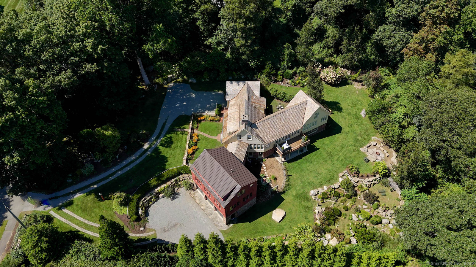 The epitome of the quintessential, sprawling, coastal New England Charmer immediately steals your heart! Strategically designed 5 BR, 4f 2 1/2 BA, 6346 sf home captures water-views of Beebe Cove & Mystic River. Noank, a quaint seaport village, known for fishing, lobstering & ship building in the early 1800's remains today known for fishing, lobstering, oystering, some of the finest beaches, sailing & marina's, historic seaside restaurants, art galleries, Mystic Seaport, aquarium, Main St. shopping, famous bakeries, countryside & charm.CT also hosts World Class Entertainment famous Foxwoods & Mohegan Sun Casinos. Noank is home to one of the longest running continuous Memorial Day parades in the country, since 1876.You might just find yourself buying or bartering for a fresh lobster or a dozen oysters right off the fishing boat. Oysters harvested year-round from the nutrient rich waters off Fishers Island Sound.Imagine this as your weekend retreat or indulge yourselves year-round.1 1/2 hr to NYC&Boston.Hand split wooden shakes, copper flashing radiant heat, air conditioning, artist chandeliers made(w/ a story to tell), sound&security system, brick floors,special lighting,attention to detail! make this home a dream.Maintained impeccably! Renovated 2024 chef's kit, leathered granite perimeter, granite 10' island, Thermador, 6' gas burner w/grill, pot-filler, custom cabinetry, open kit/sitting w/views. Enjoy the ambiance in the air in front of the cozy wood burning fireplace .