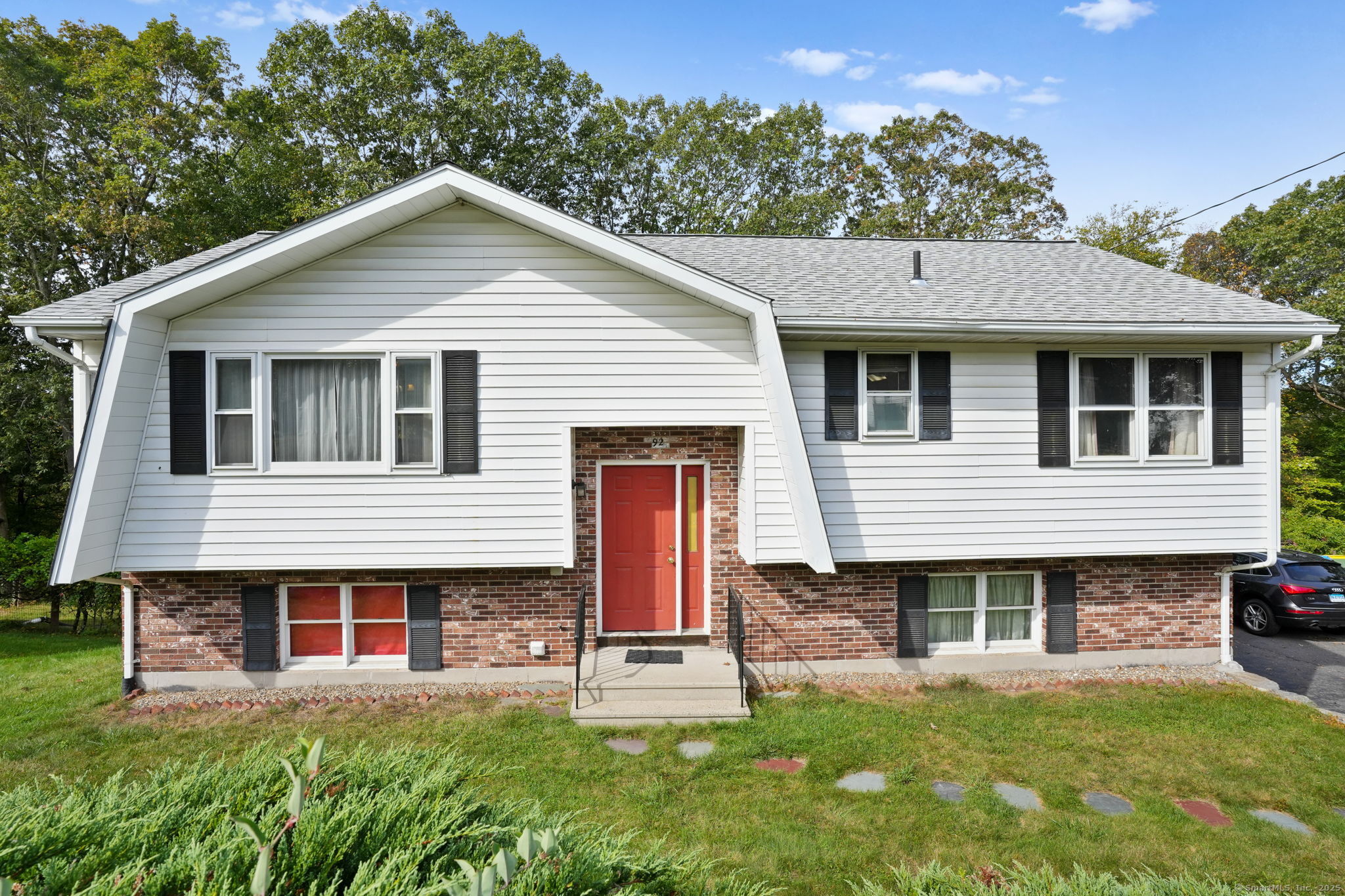 Welcome to 92 Quentin Street, a raised ranch tucked away on a quiet dead-end street in Waterbury's desirable Town Plot neighborhood. The upper level offers a sun-filled living room, a spacious eat-in kitchen with plenty of cabinets and counter space, and direct access to the 9'x13' deck-perfect for relaxing or entertaining. Three comfortable bedrooms and a full bath complete the main level.  The walk-out lower level is currently unfinished, providing great storage and endless potential to expand your living space in the future. The private backyard offers room for gardening, play, or simply enjoying the outdoors.  With its peaceful location in Town Plot, you'll love being close to local restaurants, schools, shopping, and major highways for an easy commute, while still enjoying the feel of a tucked-away residential street.  Whether you're a first-time buyer or looking to create your dream home, 92 Quentin Street delivers comfort, value, and opportunity in one of Waterbury's most sought-after areas.  Schedule your showing today!