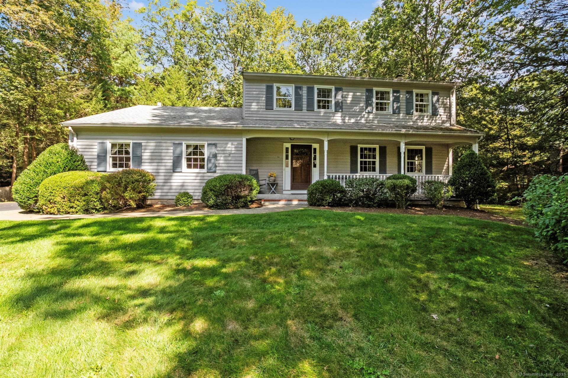 Nestled in one of Simsbury's most popular neighborhoods, this charming 4-bedroom Colonial offers the perfect blend of classic character and modern comfort. A picturesque front porch invites you to relax with your morning coffee while enjoying views of the lush lawn and mature landscaping, all beautifully maintained by an in-ground irrigation system. Inside, rich wood flooring flows through many rooms, complementing the warm and inviting atmosphere. The updated kitchen features newer appliances, a generous dining area, and opens seamlessly to a cozy family room with custom built-ins, a gas fireplace, and sliders that lead to a sunny patio-ideal for outdoor entertaining or quiet evenings. Formal living and dining rooms provide elegant spaces for festive gatherings, while the upper level offers a tranquil primary suite with a private full bath. Three additional bedrooms share an updated full bath with tub, perfect for family or guests. The partially finished lower level is ready for fun with space for billiards and a dedicated workshop area. Central air keeps you cool in the summer, and a whole house generator ensures peace of mind year-round. With public water and sewer, this home is just minutes from Squadron Line Elementary and offers the convenience of a quick closing. Don't miss your chance to own this beautifully maintained home in a prime location!