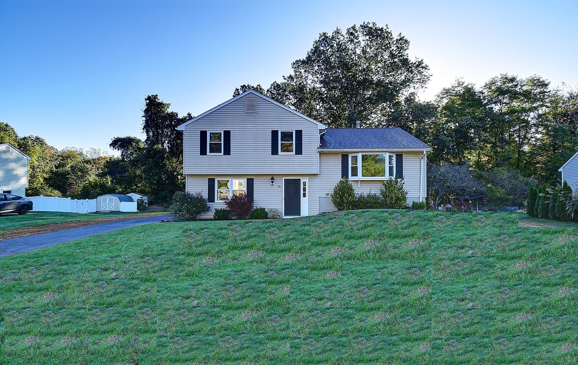 Welcome to this stunning split-level home, perfectly situated in one of Farmington's most desirable neighborhoods.  Tucked away on a quiet cul-de-sac, this charming residence offers a spacious open layout designed for comfort and connection. The inviting kitchen flows seamlessly into the dining area, which opens onto the upper deck-ideal for enjoying fresh air, relaxation, and gatherings with family and friends.  The large living room of the home is filled with natural light and opens to a spacious lower deck, providing a natural experience. It features three bedrooms full of natural light. The lovely dining area offers ample space to accommodate family and guests. The house has three zones to control the temperature.  The yard enhances the experience with a private, natural setting, offering peace and tranquility while still being close to parks and everyday amenities.   The whole house has been painted recently, and many other upgrades have been made in the past four years, ensuring this home is move-in ready, while still allowing room for your personal touch. With its charm, open living spaces, and flexible design, this property presents an exceptional opportunity to create lasting memories in a truly special home.