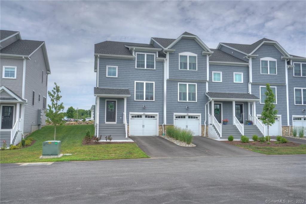 An end-unit townhouse condominium in Perkins Reserve, just minutes from downtown Mystic, is available for rent in a quiet cul-de-sac location! It offers an open floor plan on the main level displaying an elegant modern style white eat-in kitchen with stainless steel appliances, gas cooktop, and a center island that includes both a wine cooler and a breakfast bar, with a glass slider that leads to the outside deck. The kitchen opens to the dining and living room areas, and a half bath completes the main floor living space. On the upper level is the Primary bedroom that showcases a beautiful tray ceiling, walk-in closet, and private full bath with double sink, along with a second bedroom and an additional full bath. Condo is complete with central air, full walk-out basement, and a tandem 2-car garage. This is a great condo community that includes access to a fire pit, a pavilion for gatherings, and HOA amenities. Enjoy the Pequot Golf Club, located just a short drive from the townhouse. It is one of Connecticut's most scenic golf courses. A variety of local shops, restaurants, and eateries are nearby, along with easy access to the Mystic waterfront for relaxing strolls or peaceful views.