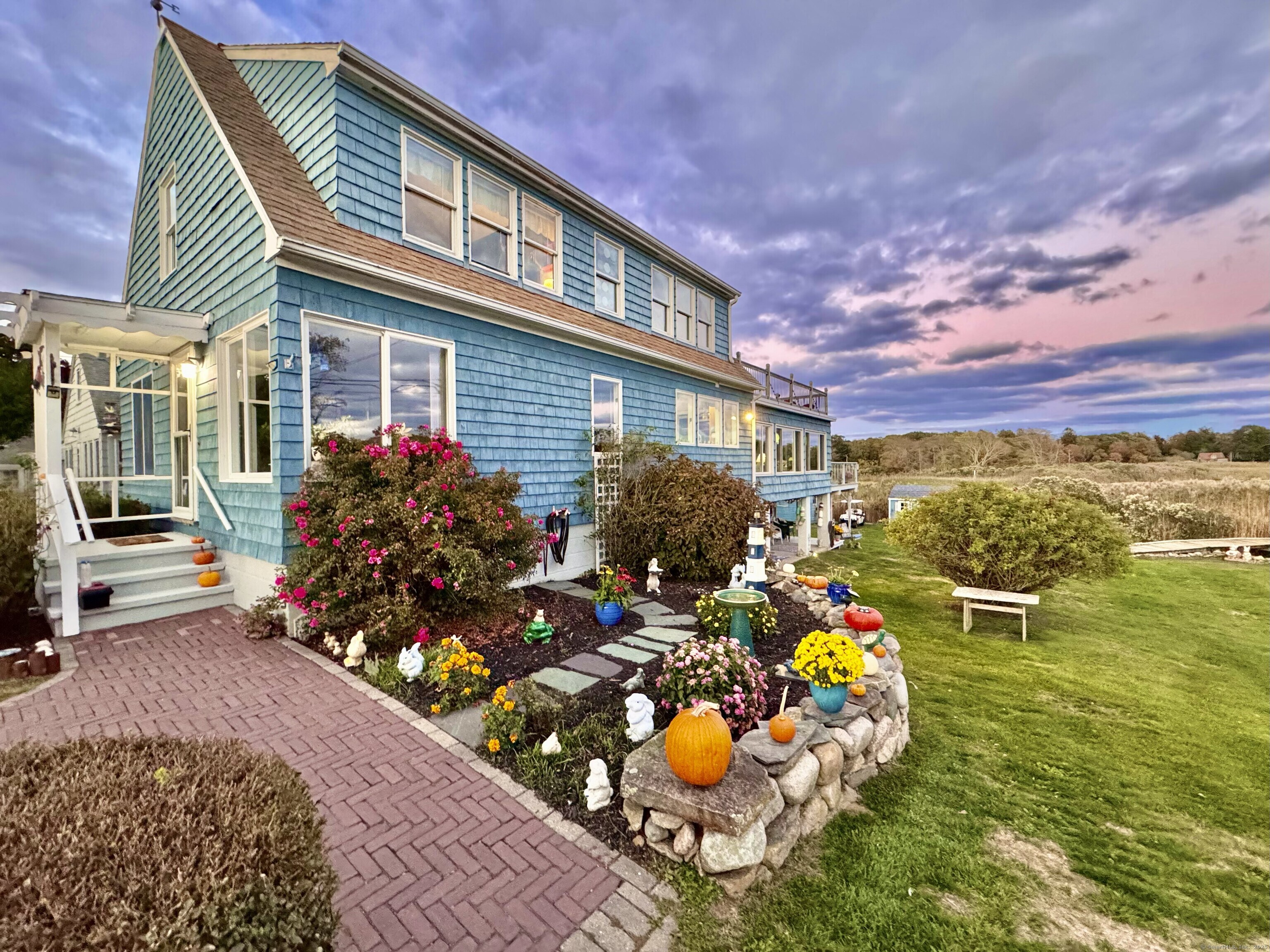 Hard to find, waterfront property with a new 50 ft dock in desirable Lord's Point community! Spend your summers in this wonderful beach community or live year round. First time ever on the market! Something for everyone sitting uniquely on .35 acres and bordering open space with 83 ft of waterfront, a 50 ft dock with 4 tie offs and room for a dry dock so bring your boats! Cape Cod all season home, much more than a waterfront cottage featuring 4 bedrooms, 2 full baths, open and spacious floor plan with lots of windows and ocean views, balcony seating, patio and even built in dock seating. Fun outdoor shed with 4 bunks, electricity and a tv for a fun summer hideout. You can walk to one of 6 beaches (Open Way, Tim's Beach, Boulder Beach, Hopkins Beach, Pebble Beach, and Trestle Beach), ride bikes, play tennis, bocci, basketball, pickleball or clubhouse activities. Close to Mystic Indoor sports, Stonington Borough , Downtown Mystic (great restaurants) and Rhode Island beaches within minutes. Not to mention Foxwoods's Resort and Mohegan Sun Resorts nearby. Hard to get into this community! Plan ahead now! Seller will consider a rent back or must secure suitable housing prior to closing.