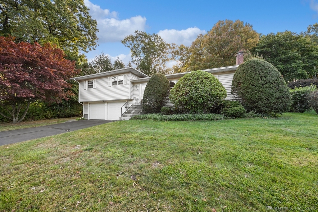 Welcome home to this inviting 3 bedroom split level offering plenty of space and character! Enjoy a large living room featuring a beautiful fireplace framed by built-in bookcases on both side. The formal dining room opens to an eat-in kitchen and a bright three season sun room that fills the home with natural light. The interior has been freshly painted and professionally cleaned-with one and a half baths-laundry on the main level, central air, a full basement for extra storage and a 2 car garage this home has it all. Subject to Probate Approval.