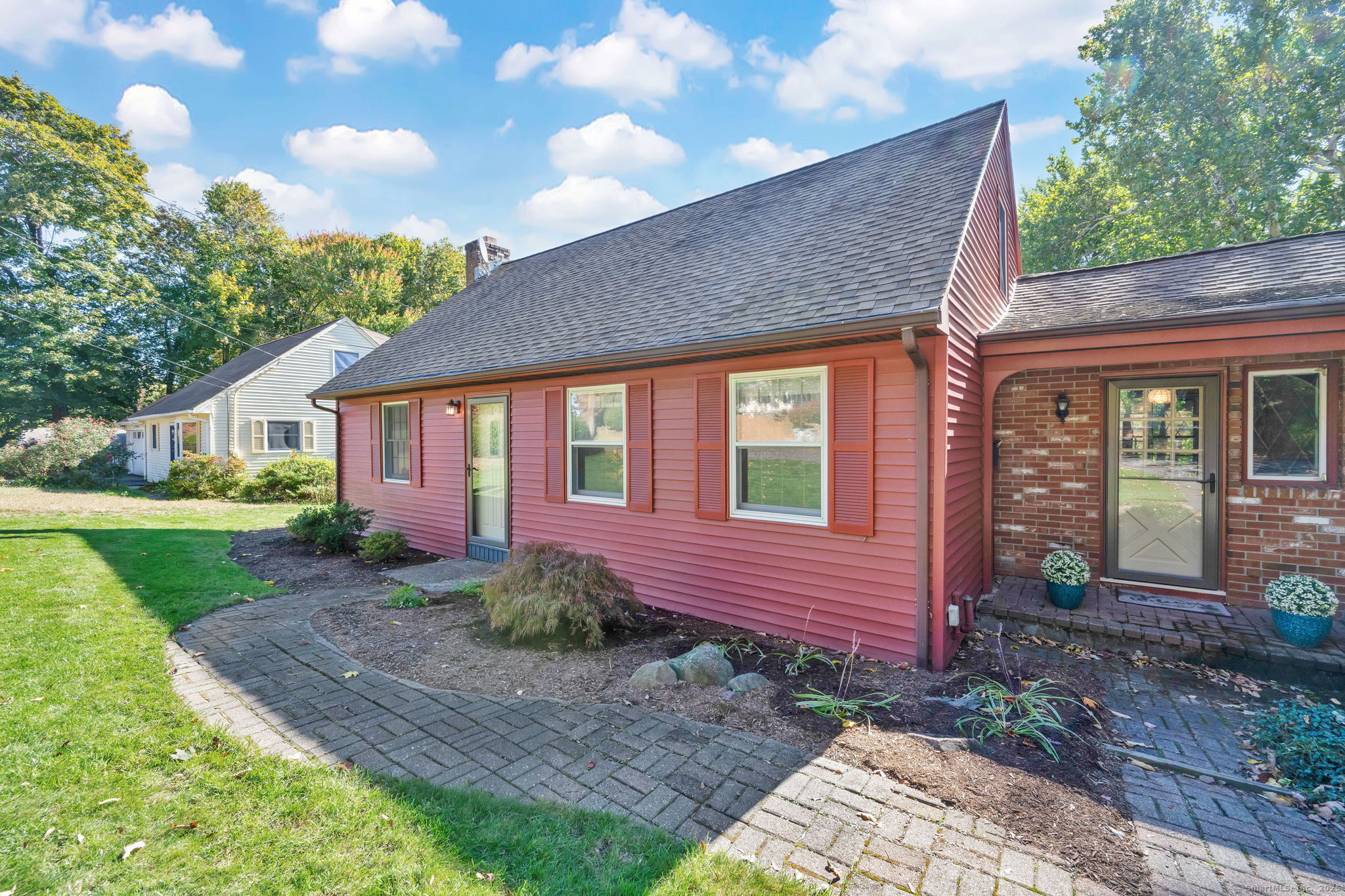 OFFER DEADLINE - TUESDAY, OCTOBER 21 at 5 pm. - Charming, Well-Maintained Home on a Quiet Cul-de-Sac  Welcome to 16 Knox Place - a beautifully maintained home offering 1,534 sq. ft. of comfortable living space in one of Bristol's most desirable walkable neighborhoods. Built in 1963 and thoughtfully updated in the 1980s and early 2000s, this home blends traditional craftsmanship with modern comfort.  Town records list the home as having two bedrooms, but it actually includes three - two on the main level and one upstairs. The main-level en-suite offers flexible use as a bedroom, den, or family room, with direct access to the deck and beautifully landscaped backyard.  Inside, you'll find a warm living room with hand-crafted wood shiplap beams, skylight, and fireplace, along with a mix of gleaming hardwood floors and plush carpeting. The central-air system (replaced 2020) ensures year-round comfort.  The kitchen and dining areas overlook the flat, private backyard surrounded by mature trees and lush plantings. A front-lawn sprinkler system keeps the curb appeal picture-perfect. The full basement provides abundant storage and includes a heated room with a walkout - ideal for a family room, office, workshop, hobby space, or future expansion.  Set on a .29-acre lot at the end of a peaceful cul-de-sac with only four houses, 16 Knox Place offers privacy, pride of ownership, and convenience - just moments from shops, restaurants, and local activities.