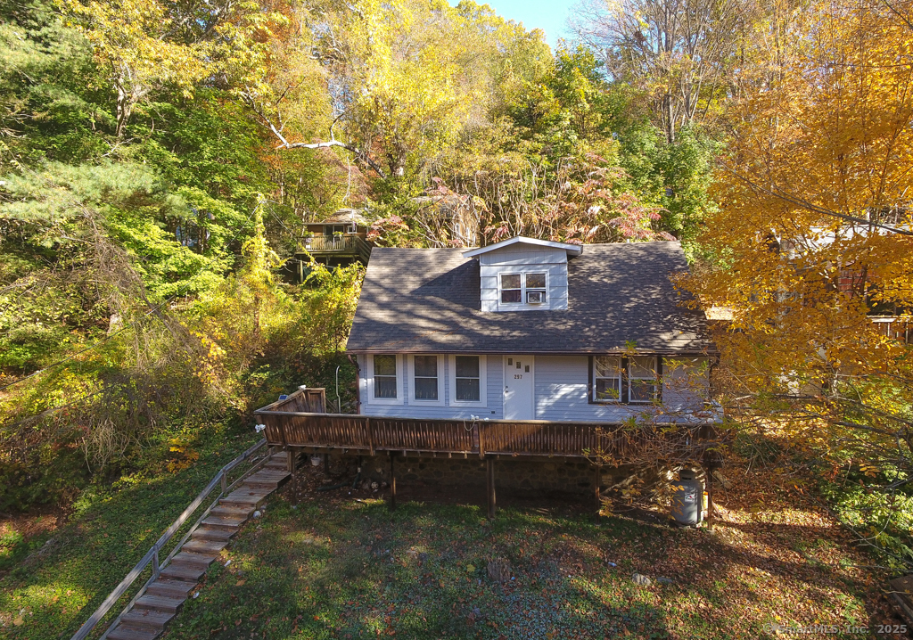Fantastic opportunity at this 3 bedroom Cape with detached garage on the navigable portion of the Pomperaug River! The house sits across the street and high above the water with a large deck on the front of the home to take in the view. The 2 car garage has a bonus room and is waterfront property with the potential for a dock. You can see Lake Zoar and the River Rd bridge from here. Inside the home offers a large living room, separate dining room, kitchen and primary bedroom on the first floor. Upstairs are two more bedrooms and a second bath. Freshly painted exteriors and brand new roofs on both buildings.