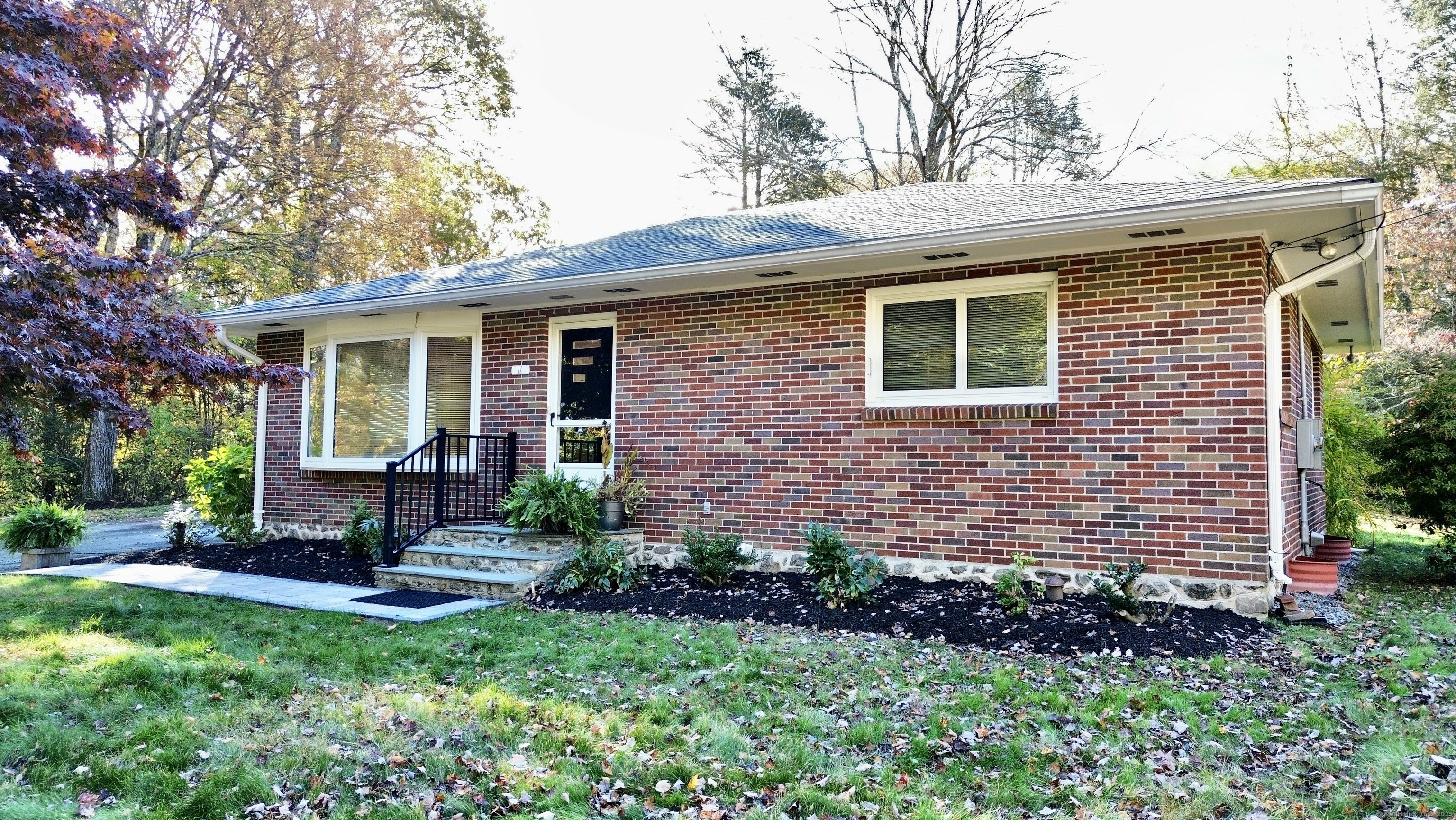 Discover your dream home at 11 Upper Whittemore Rd, a stunningly renovated Brick Ranch nestled on a private, dead-end street with over 1.37 acres of beautiful land. This oasis boasts an unbeatable location because it provides both seclusion and connectivity: you're just moments from the recreational fun of Lake Quassapaug and Quassy Amusement Park, and the property offers easy access to major highways for simple commuting. Step inside to find a brand-new, modern kitchen featuring Carrara-style quartz countertops, stainless steel appliances, and gorgeous subway tile. Recessed lighting illuminates the entire home, highlighting gleaming hardwood floors, new crown molding, trim, and doors. The fully renovated bathroom completes the luxury, offering a beautifully tiled shower and an oversized vanity. This home is built for low-maintenance living with a brick exterior and features a brand new well holding tank. One of the key features is a fantastic oversized shed/garage-perfect for a workshop or storage. Home is being finished and sold as is, this is a rare chance to secure a high-end, private retreat in a prime Middlebury spot!