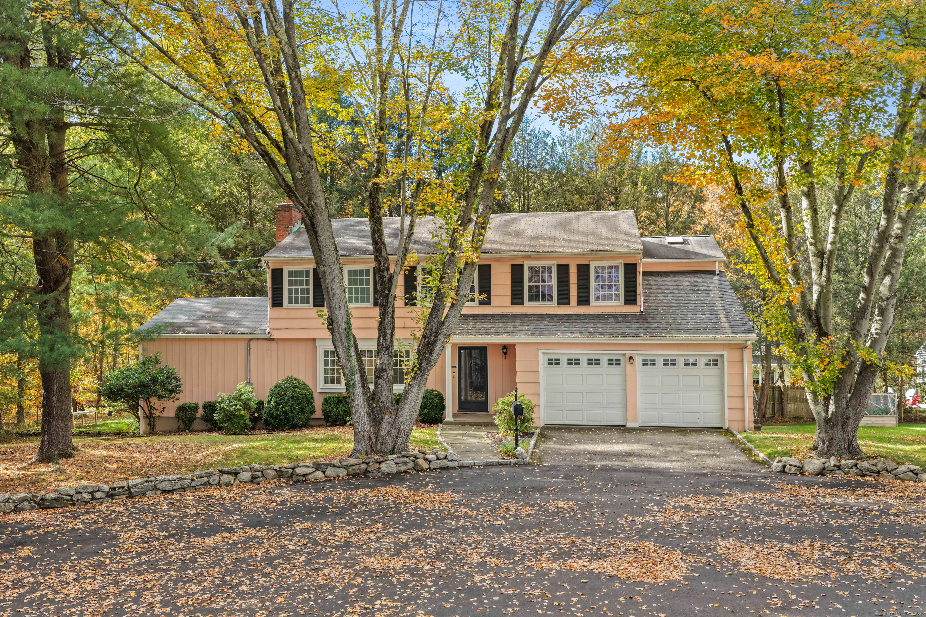 First time ever on the market after 58 years with one loving owner. Set on a quiet cul-de-sac backing up to protected open space, this classic New England Colonial offers timeless appeal and remarkable potential in Fairfield's sought-after University area. The traditional layout begins with a welcoming living room anchored by a wood-burning fireplace, leading to a spacious great room with vaulted ceilings - the heart of the home. A large eat-in kitchen and formal dining room create an ideal flow for gatherings, while a flexible main-level bedroom suite with full bath provides an option for first-floor living. Upstairs are four additional bedrooms, including an en suite primary, plus another full bath. The setting is serene and private - a rare retreat just minutes from downtown Fairfield, train, beaches, and schools. With city water, sewer, natural gas heat, and not in a flood zone, it's the perfect canvas to renovate, expand, or build new. Lovingly cared for by current owners for nearly six decades, this is an extraordinary opportunity to reimagine a well-loved Fairfield original. An heirloom property ready for its next story. Home being sold as is.