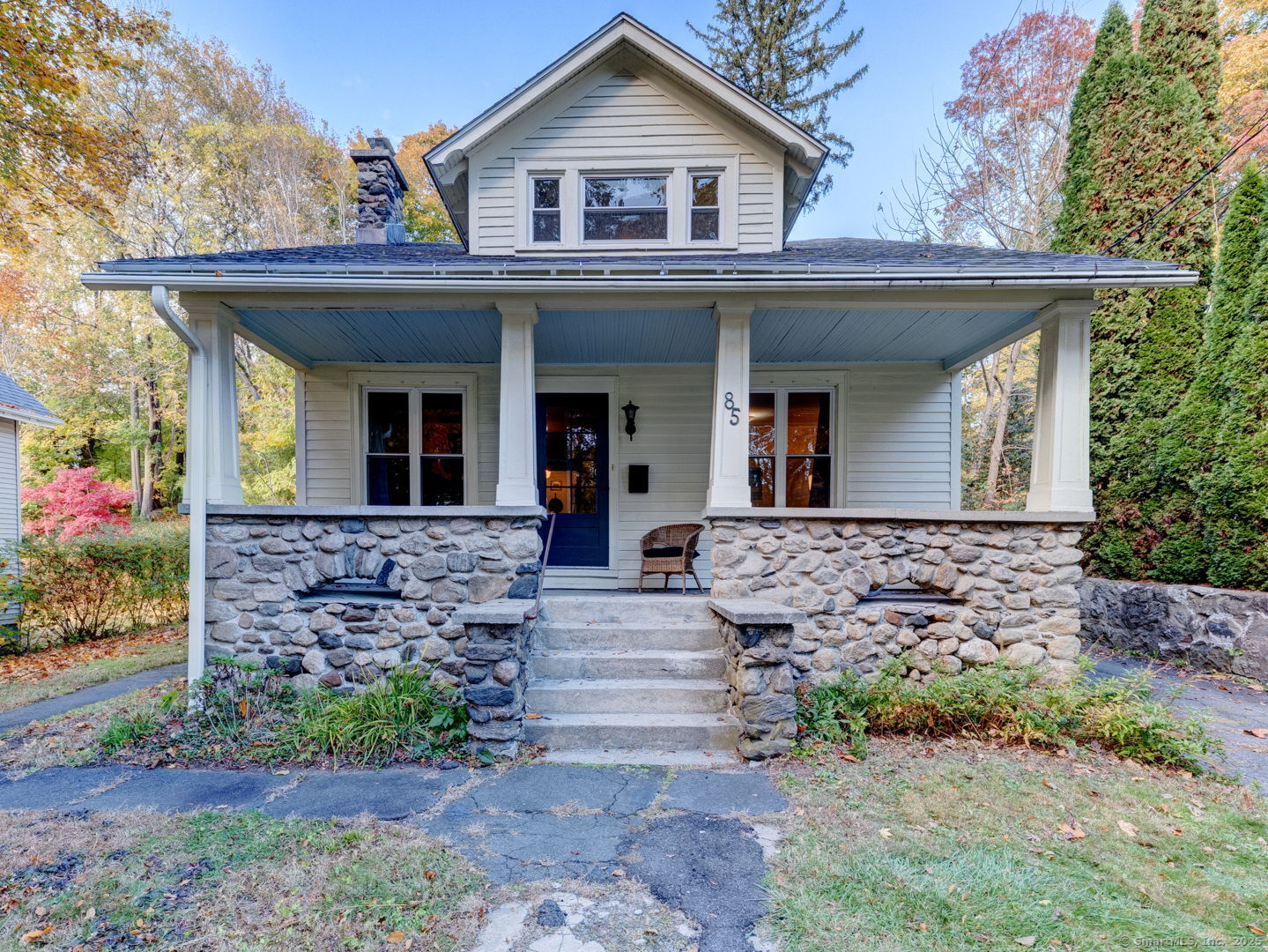 Welcome to this Craftsman-style home on the east side with many recent updates and many original, preserved wood and built-in features intact. Stone front porch, hardwood flooring and ornate molding throughout with solid wooden doors and storm doors. Two full baths, one on main level. Current large dining room on main floor has a closet and could easily be converted back to a primary bedroom. Stackable washer and dryer on main level, working fireplace, new roof (completed in two parts in 2022 and 2025), dry basement with professionally installed permanent dehumidifier. Upstairs features three additional rooms with a full bath. Plenty of closet space, including two walk-in closets. Other features include updated thermopane windows, exterior freshly painted in 2024, new oil tank in 2023, new water pump in 2022. Plenty of charm and character left in this well-built home.