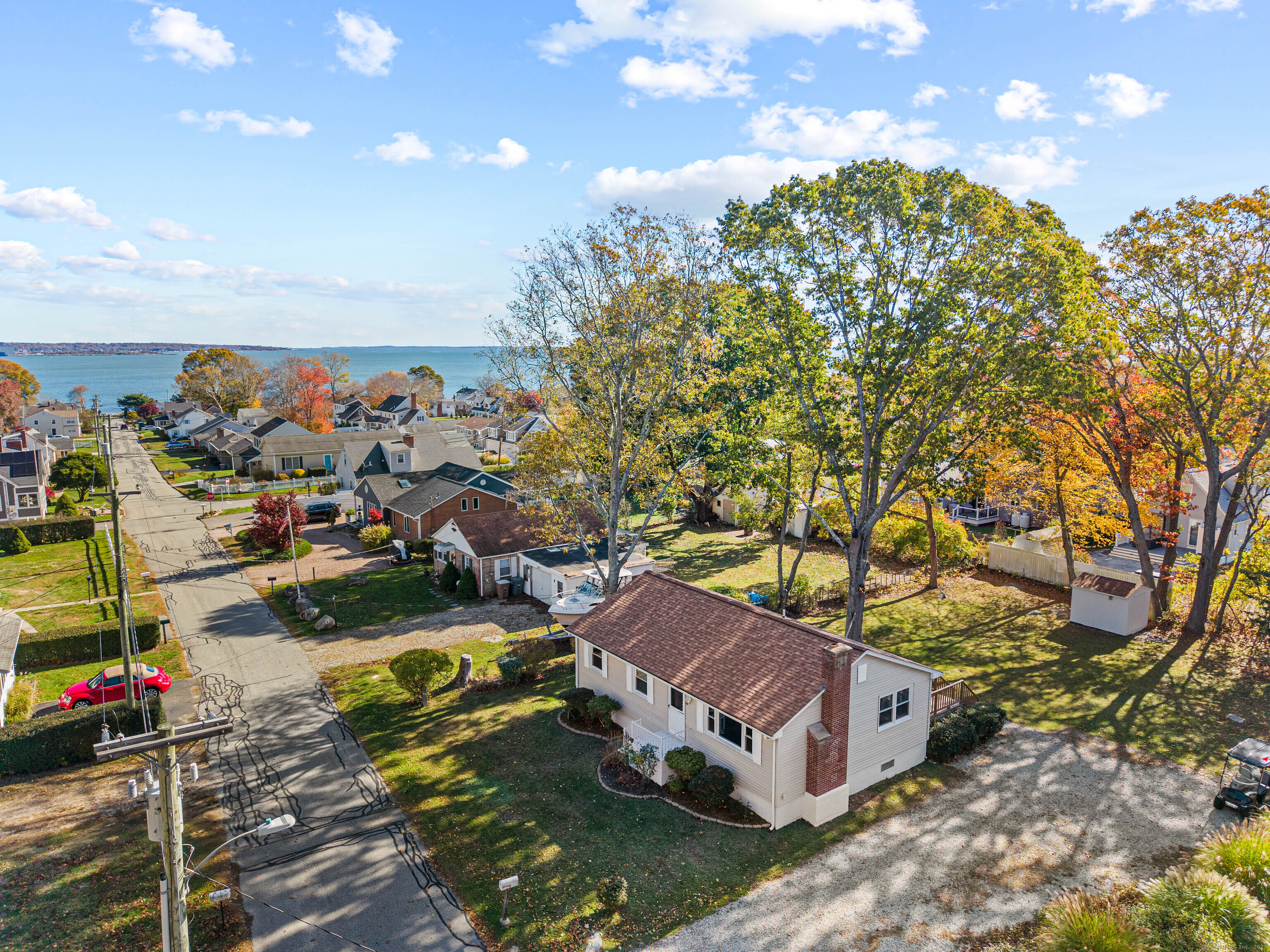 Located within the sought-after Black Point Beach Association, this beautifully renovated coastal home blends modern style with timeless New England charm. Just steps from the shoreline, it offers vaulted ceilings, recessed lighting, and rich hardwood floors that flow through a bright open layout. The kitchen features granite countertops, a center island with seating, stainless steel appliances, and crisp white cabinetry-perfect for both entertaining and everyday living.  A convenient stackable washer/dryer and updated mechanicals, including a high-efficiency furnace, tankless hot water system and central A/C, provide comfort and efficiency. Outside, enjoy a spacious yard shaded by mature trees and a private driveway.  The Black Point Beach Association enhances the lifestyle with access to private beaches, community clubhouse, tennis and basketball courts, and social events-making this home ideal as a year-round residence or weekend escape. Experience the best of coastal Connecticut living where community, recreation, and relaxation meet.