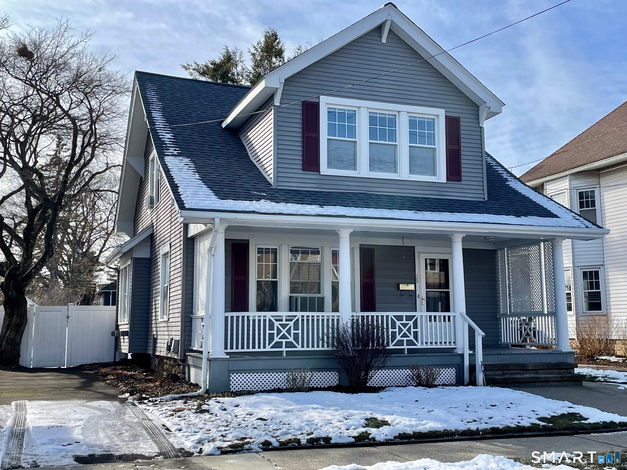 Nestled in a highly desirable area, this classic colonial home offers the perfect blend of character, space, and convenience. A lovely front porch welcomes you-ideal for morning coffee or relaxing evenings.  Inside, the home features 3 spacious bedrooms and 1 full bath (on the second floor). The large living room boasts a cozy fireplace and is enhanced by beautiful original French doors that open gracefully into the space. The adjoining dining room is highlighted by a charming leaded window, adding warmth and character. The kitchen includes a butlers pantry and offers great potential for customization.  This home showcases all original woodwork throughout, and hardwood floors lie beneath the carpet in both the living room and dining room, ready to be uncovered. The layout offers spacious rooms and timeless appeal.  Outside, enjoy a level, fully fenced-in yard-perfect for outdoor entertaining, pets, or play-along with a deck off the back of the house. While some minor updating is needed, the home presents a wonderful opportunity to restore and personalize a truly special property.  Located in close proximity to everything, this home combines classic charm, outdoor space, and an unbeatable location. A rare find in one of the most desirable areas-don't miss it!