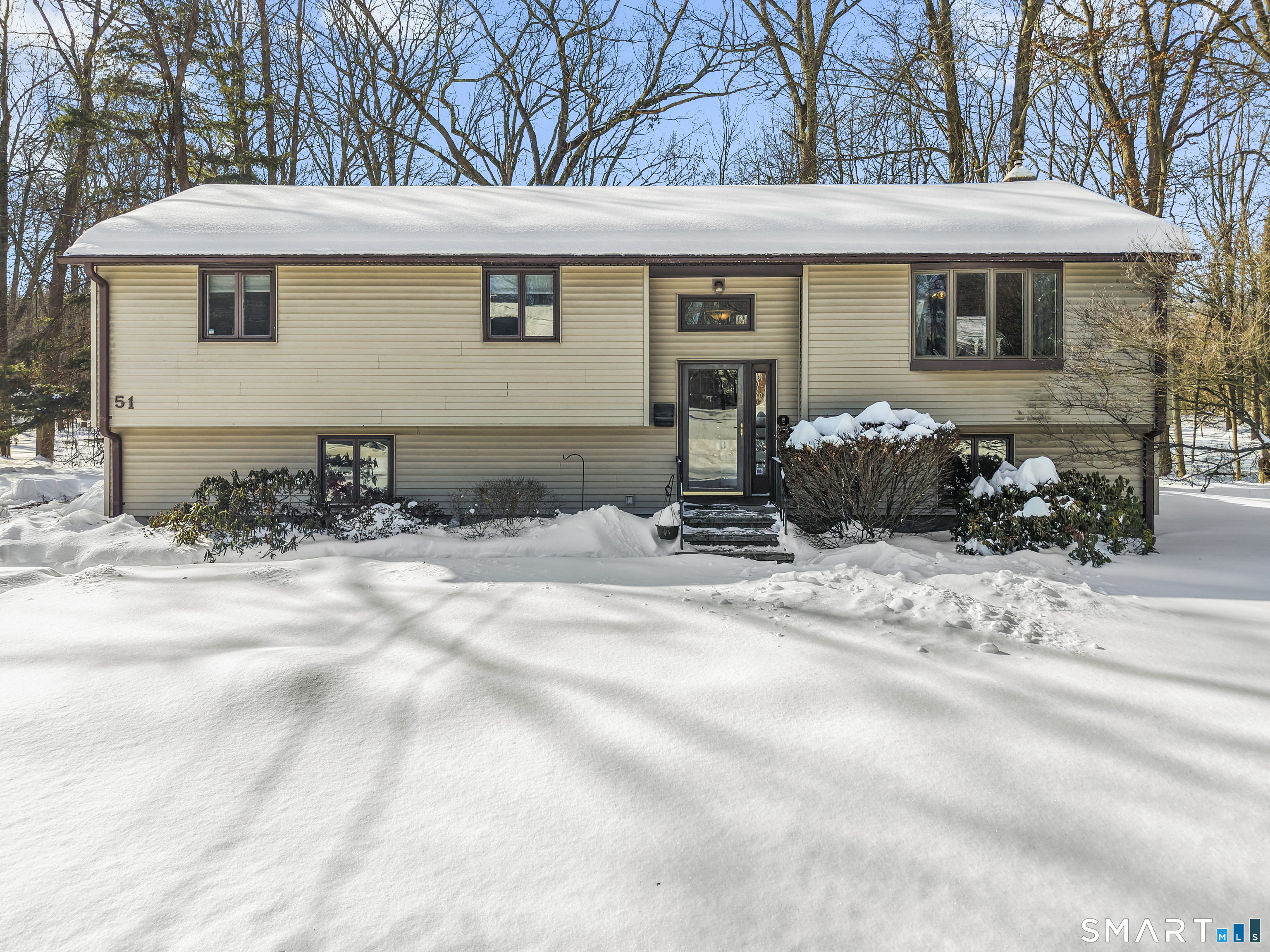 This is not your typical raised ranch!! Welcome to 51 Barrett Rd! Nested in the charming town of Enfield which sits on .48 acre at the end of a cul-de-sac. This home offers the best of both worlds - the spaciousness of a raised ranch with the convenience and flow of a traditional ranch style floor plan. Now step inside to discover this 1820 total sq ft thoughtful designed living level that feels open, inviting with a pellet stove for charm, coziness, and can be used as additional heat source. 3 spacious bedrooms, 2 full baths, open kitchen with breakfast bar , stainless steel appliances. Walk down to your finished lower level to be used for a family room, playroom, exercise room, with an additional second pellet stove. Walk out the slider door to your patio and private yard. Sprinkler system front and side, 2 car garage under house walk in access. Located near parks, shopping centers, restaurants perfect for those buyers that enjoy convenience and comfort.