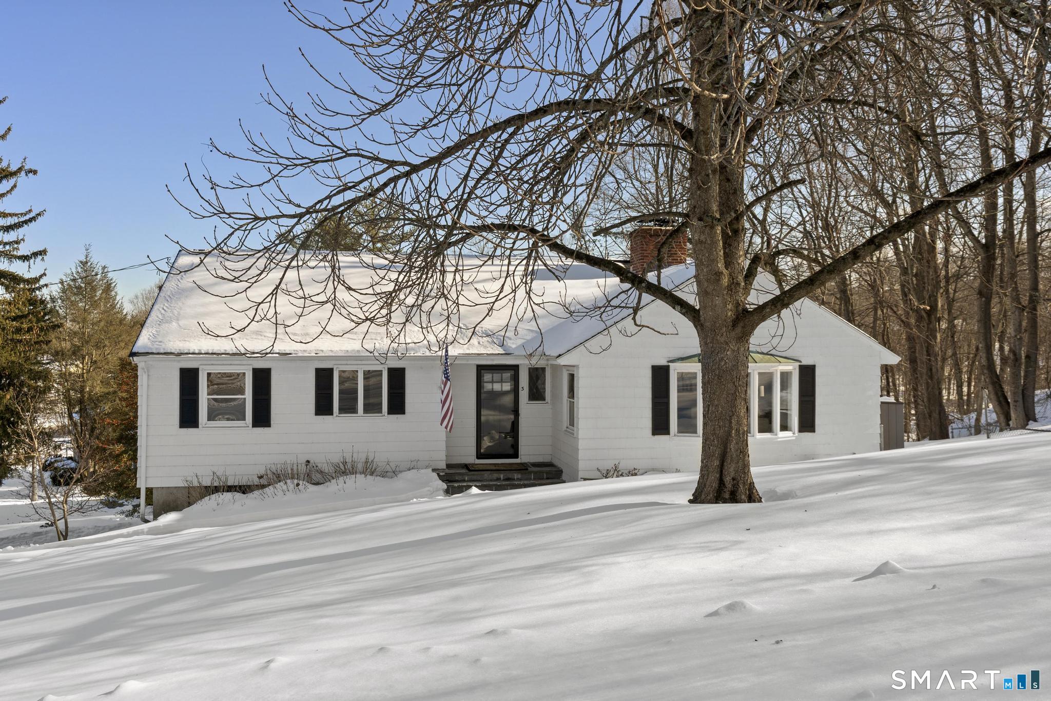 Located in the desirable Buena Vista neighborhood, this well-maintained home blends timeless charm with thoughtful updates. The spacious, sun-filled living room features a cozy fireplace and bay window, accented by beautiful hardwood floors. The remodeled kitchen is truly the heart of the home, offering stylish finishes, new flooring, and generous space for everyday dining. Freshly painted throughout in a modern, neutral palette, the home feels bright and inviting at every turn. A charming sunroom/three-season room overlooks the backyard, creating a delightful treehouse-like retreat where you can enjoy a peaceful, park-like setting with neighboring preserved woods and a gently running brook. The partially finished attic adds flexible space along with abundant storage. The finished lower level offers additional living space with a brick fireplace, full bath, laundry room, a large utility/furnace room with built-in storage, and walk-out access to the back patio. Additional highlights include a large two-car garage with an attached workshop/utility room. Outdoors, a lovely backyard patio provides the perfect setting for entertaining. Enjoy an exceptional location within walking distance to Cornerstone Pool, Buena Vista Golf Course, Veterans Memorial Ice Skating Rink, public tennis courts, the Art Center, and the Reservoir. Just minutes from Westfarms Mall, Blue Back Square, and West Hartford Center's popular shops and restaurants. New roof and replacement windows com