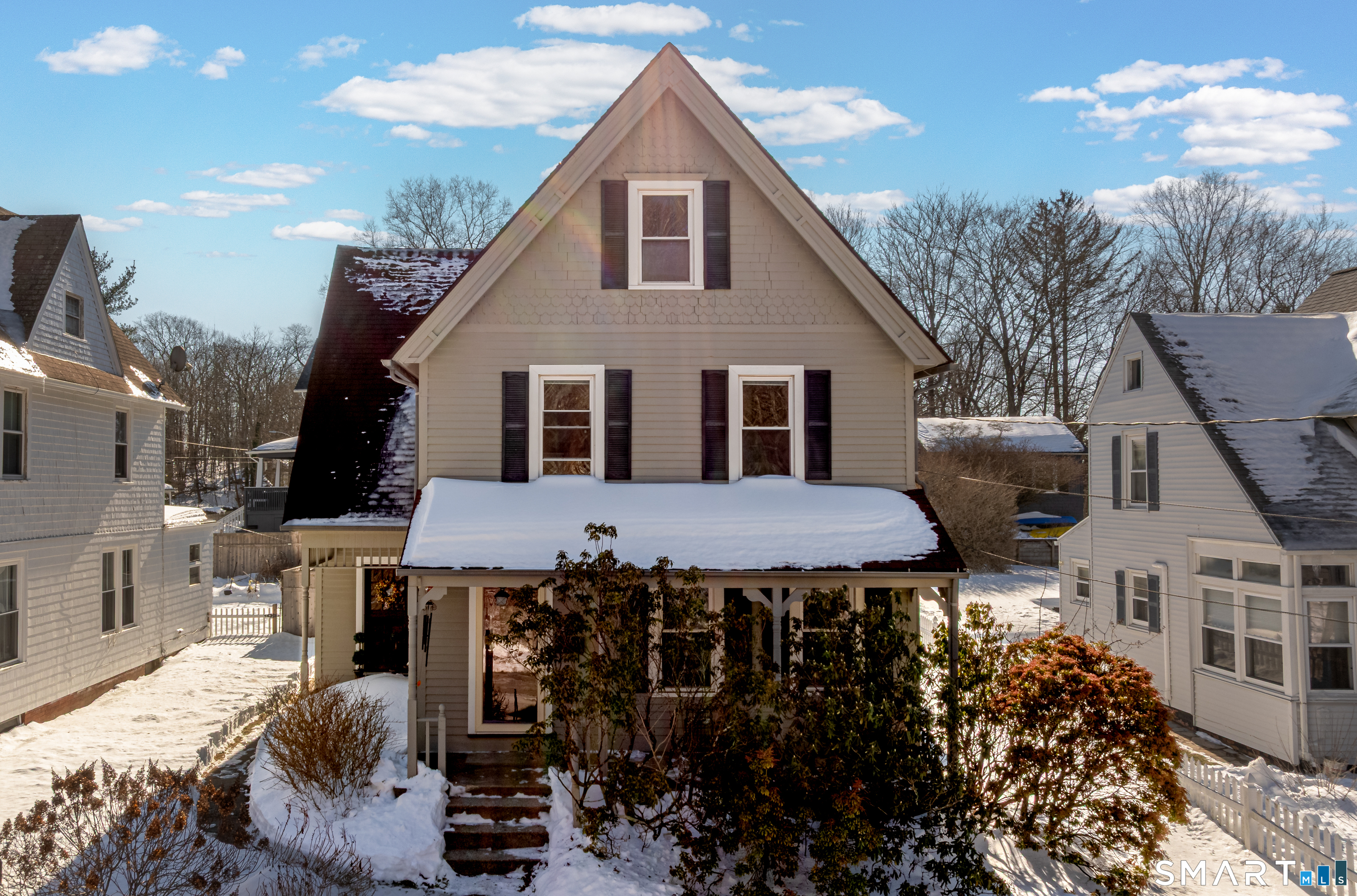 Set on a quiet, tree-lined street directly across from Mohican Park, this charming, antique Colonial (circa 1895) blends timeless character with modern updates. On the main level you will find beautiful architectural details including 9-foot ceilings, crown molding, hardwood floors, French doors and built-ins. With over 2,000 square feet, there is plenty of room for all to enjoy. The main level features a lovely sitting room, a cosy living room with built-ins, a dining room and a large eat-in kitchen with SS appliances. You will find one full bath and one half bath on this level. There are three spacious bedrooms on the upper level with 2 additional rooms (being used as bedrooms) in the finished attic. Another full bath is located on the upper level as well. New updates include a gas boiler (2024), hot water heater (2025) and exterior paint (2023). An oversized one car garage adds everyday convenience with room for car and/or storage, motorcycle etc. The private backyard provides a wonderful setting for entertaining friends, perfect for summer get togethers. With scenic views and easy access to outdoor recreation just steps from your front door, this home is a wonderful opportunity to own a beautiful home in an exceptional location.