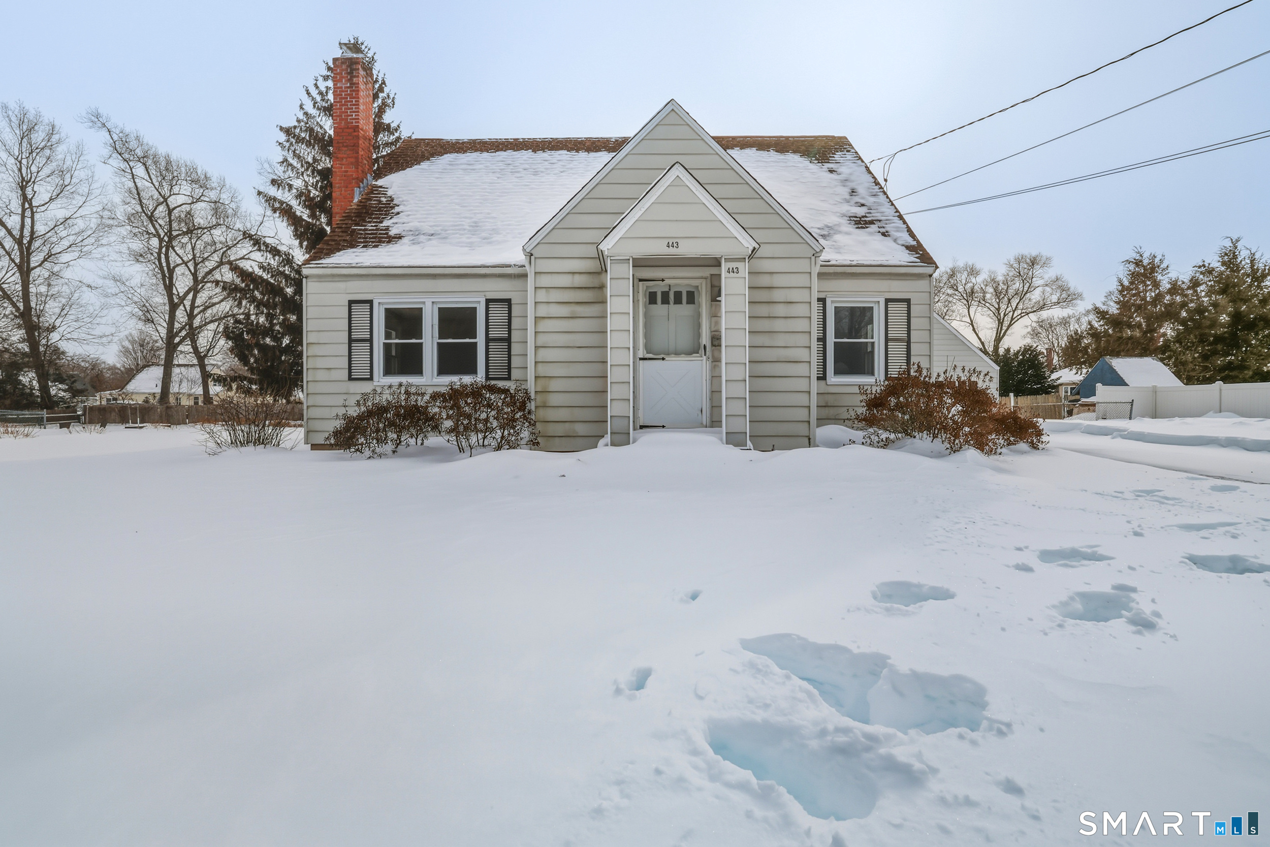 Welcome to 443 Elm Street in Windsor Locks! This charming Cape-style home is full of potential and ready for your personal touches. The main level is currently set up with an eat-in kitchen, a comfortable living room, two first-floor bedrooms-one of which could easily serve as a formal dining room-and a full bathroom. Whether you're looking for convenient one-level living or flexible space to suit your needs, this layout offers wonderful versatility.  Upstairs, you'll find one finished bedroom plus a spacious attic area just waiting to be transformed into a stunning primary suite. With room for a full bathroom or a generous walk-in closet, the possibilities are exciting. The unfinished basement includes a toilet and shower, providing a great starting point for future expansion. Outside, enjoy a large, level backyard with a detached two-car garage offering plenty of storage and workspace. With low-maintenance aluminum siding and so much opportunity to build equity, this home is a fantastic chance to create something truly special.