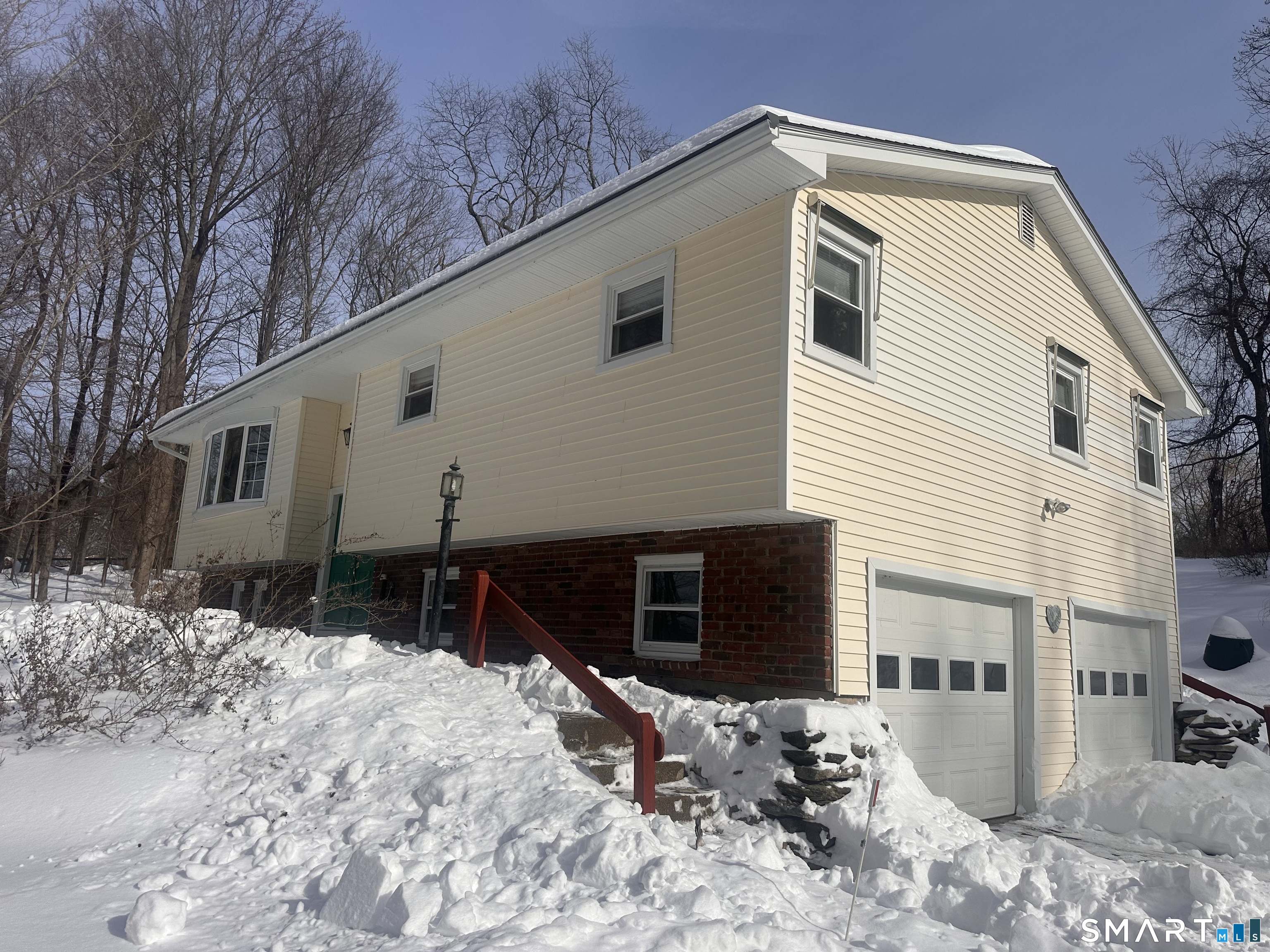 This lovely 3-bedroom, 2-bath home has everything you've been looking for - space, charm, and the perfect layout for everyday living and entertaining!   Features You'll Love: * Bright kitchen with a stunning skylight that fills the space with natural light * Bathroom also features a skylight for that fresh, open feel * Cozy living room + 2 bedrooms with plush carpeting * Elegant hardwood floors in the dining room and hallway * Spacious finished basement - perfect for a family room, gym, or home office * 2-car garage with plenty of storage Step right from your kitchen onto a beautiful backyard deck - ideal for entertaining, summer BBQs, or relaxing evenings under the stars. With solid bones and a great layout, this home is ideal for buyers looking to add their personal touch and build equity.