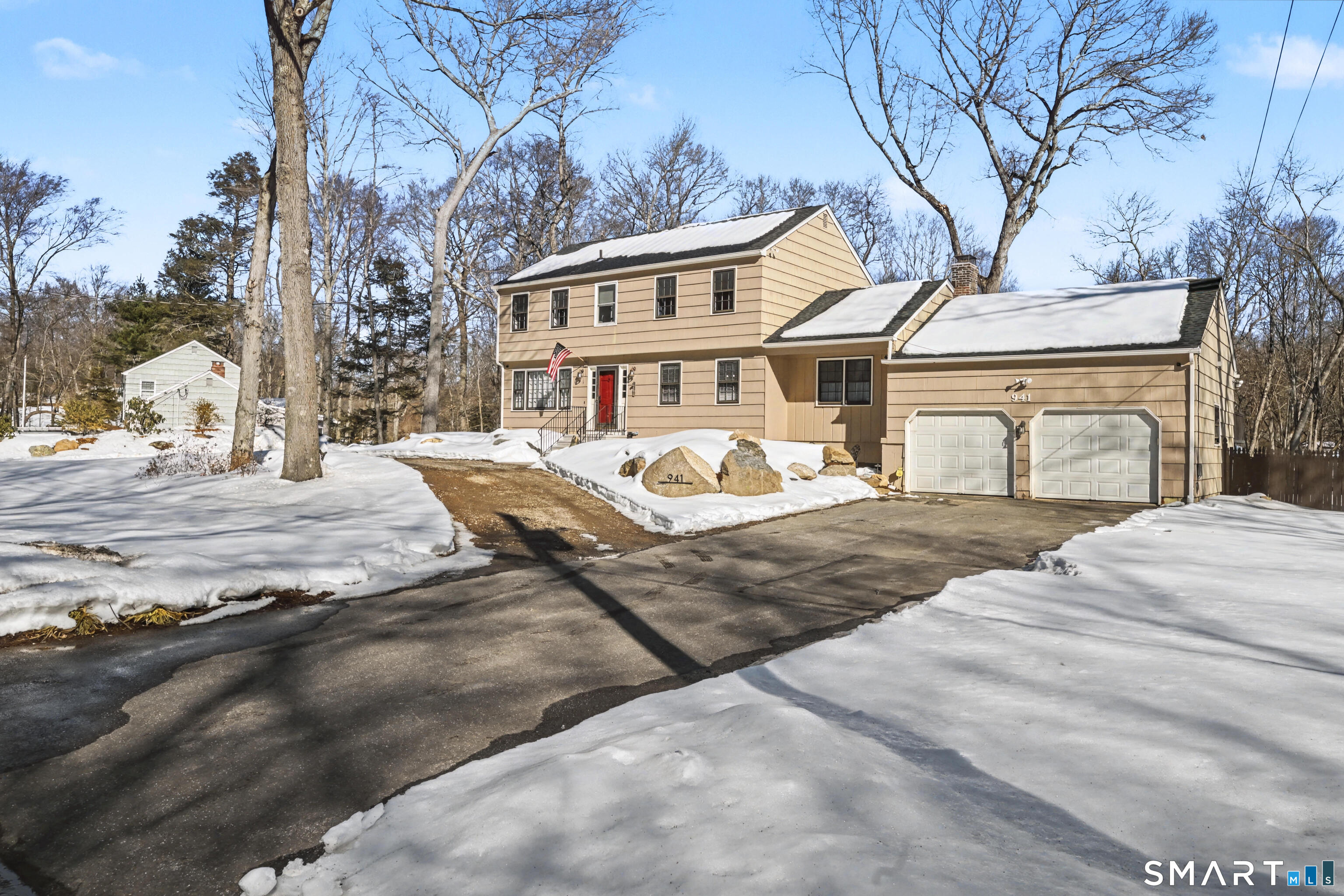 The one you've been waiting for! Welcome to 941 Garden Rd. This 4 bedroom, 3 full bath Colonial is perfectly set on 1.19 acres in one of Orange's most desirable locations and offers the ideal blend of timeless charm and meaningful updates. From the moment you step inside, you'll appreciate the craftsmanship, highlighted by classic picture frame molding and beautiful hardwood flooring throughout. The layout offers both comfort and functionality, ideal for everyday living and entertaining alike. A standout feature is the bonus three season porch with a cozy wood stove, creating the perfect space to relax nearly year round. Sliders open to a spacious wraparound deck that overlooks the private backyard oasis. Spend your summers enjoying the inground pool, surrounded by professionally designed hardscapes, mature plantings, and a thoughtfully transformed exterior. A private access road to the lower yard adds both convenience and versatility. Recent updates provide peace of mind, including three fully renovated bathrooms, a new septic tank, roof, and central air mechanicals. Situated in the highly regarded Amity School District and moments from shopping and amenities. A truly rare offering you will not want to miss.